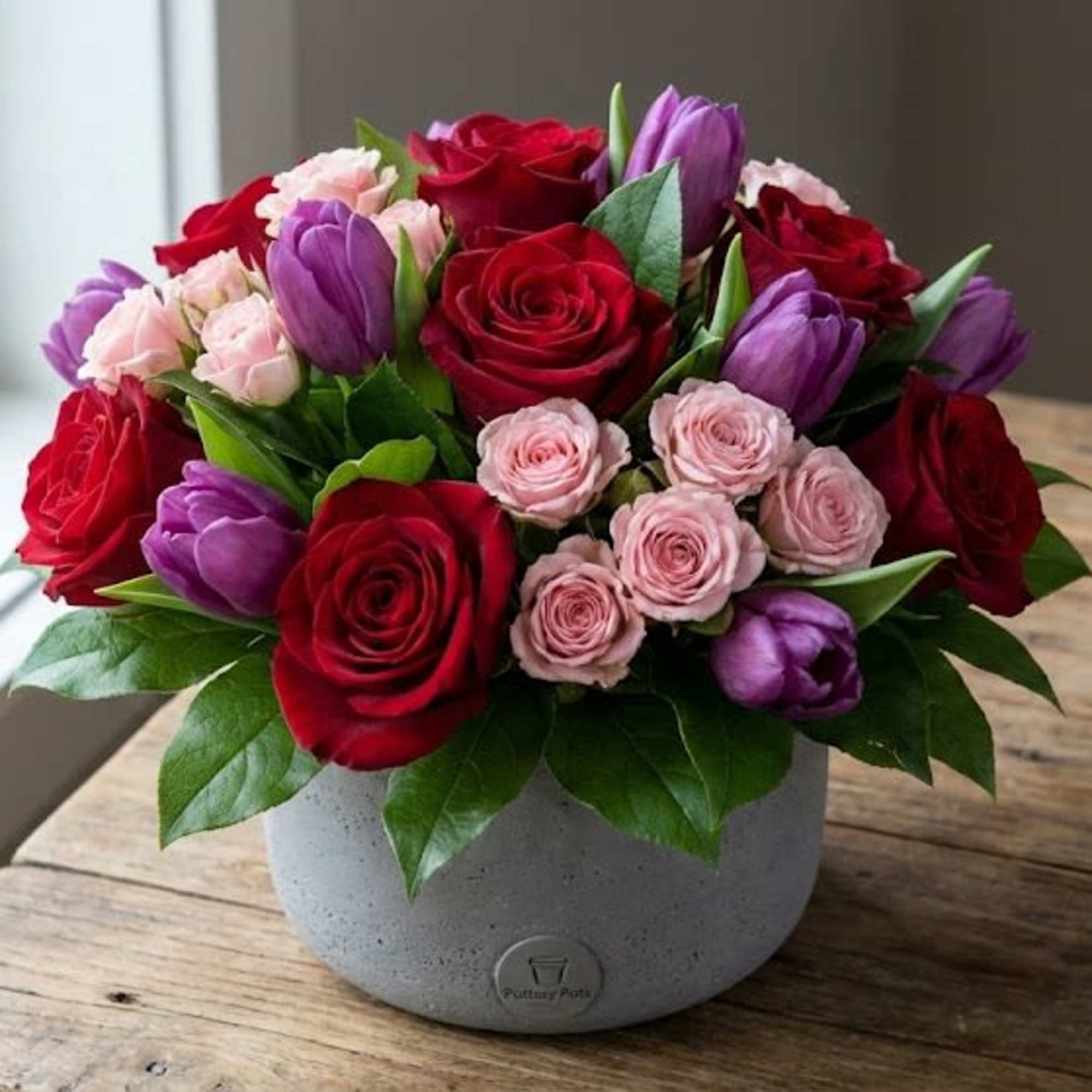 A mix of premium florals such as but not limited to Roses