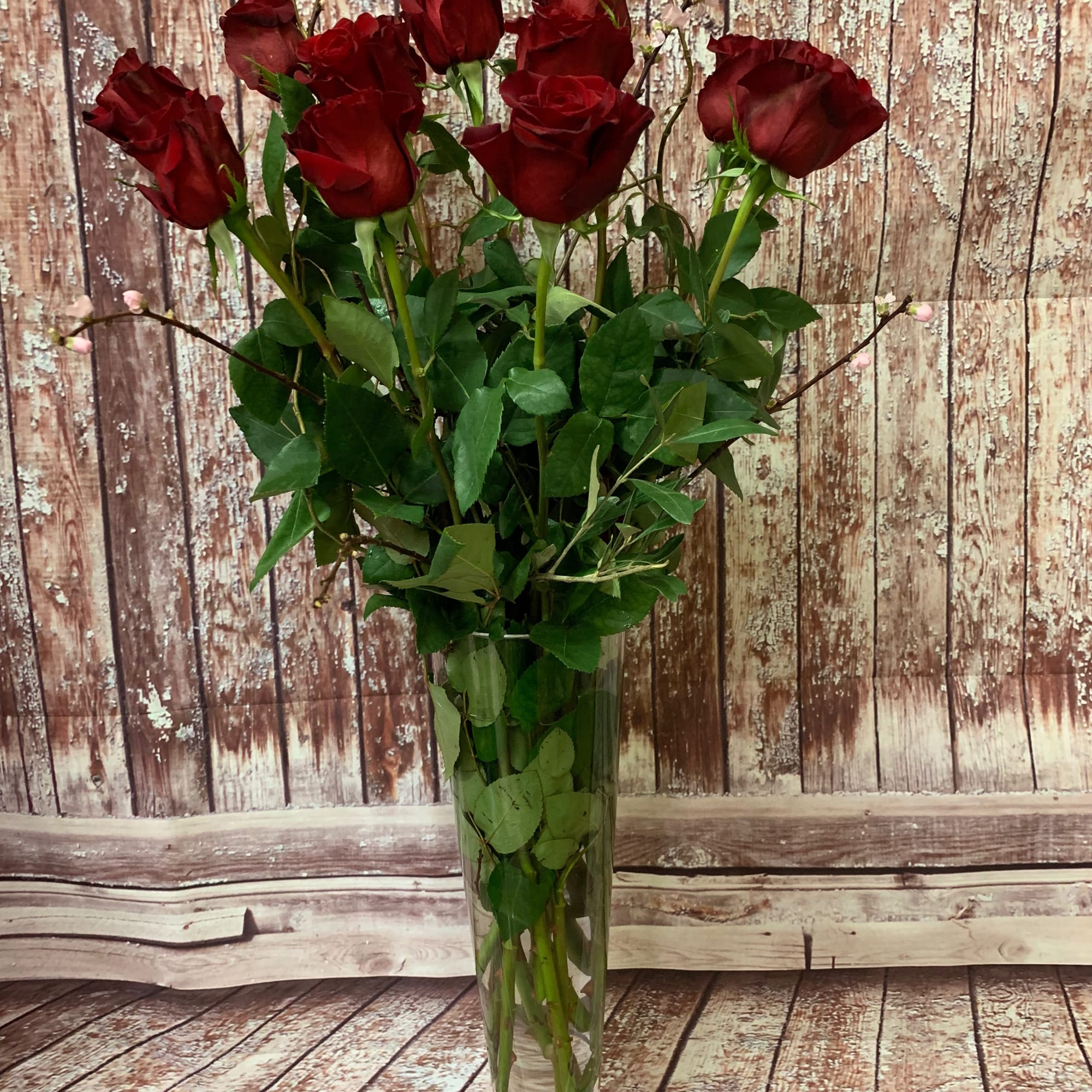 A charming bouquet of a dozen (12 stems) of long-stemmed red roses