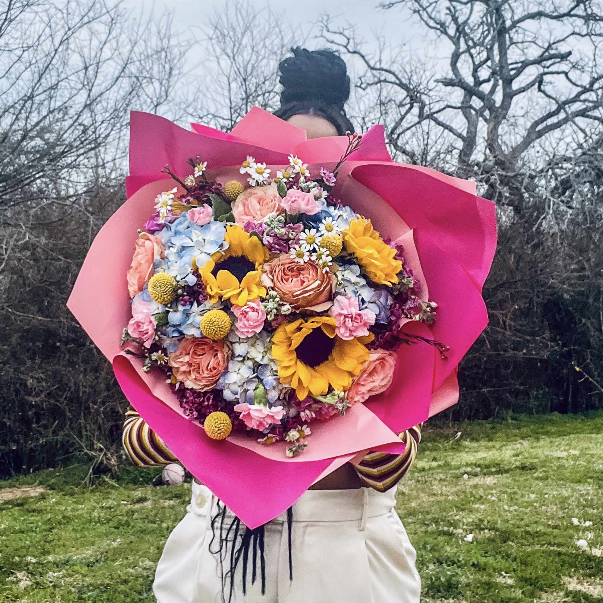 Designer Choice Sunflower hand Wrapped bouquet. Filled with Roses, Hydrangeas, Stock and