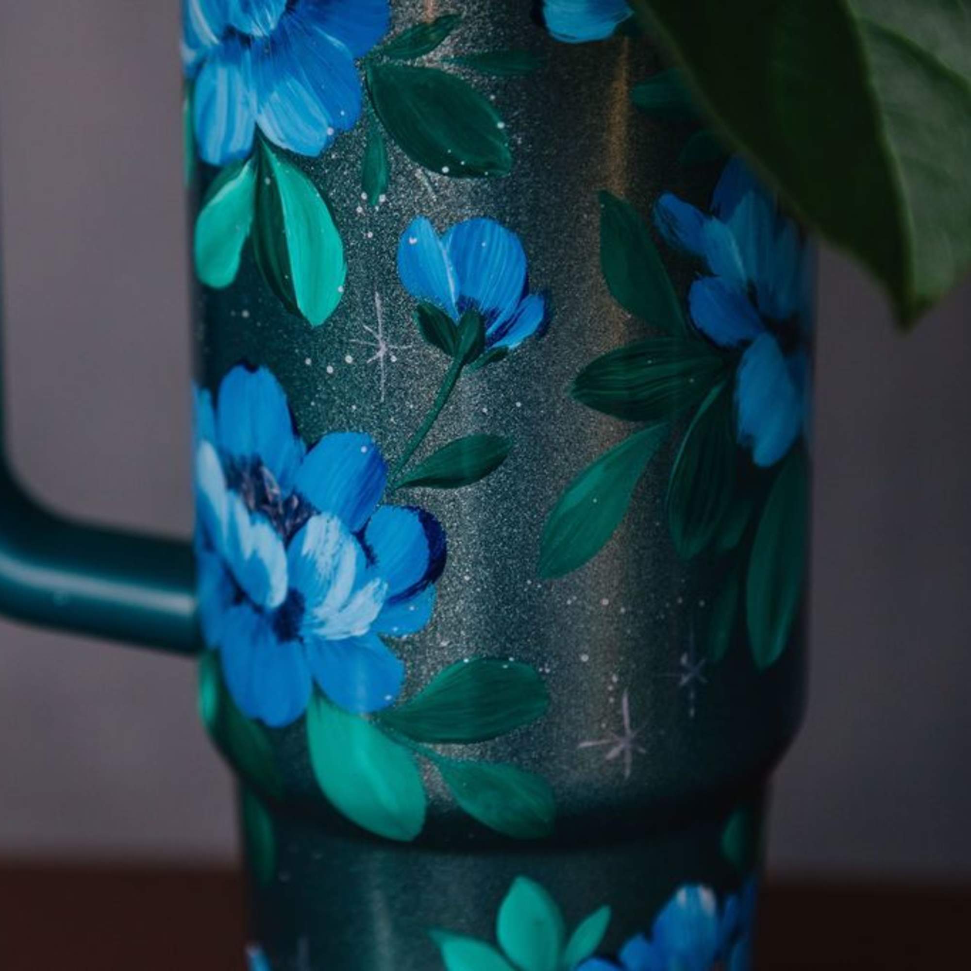 This 42 oz Stanley tumbler is a one-of-a-kind, hand-painted piece sealed with