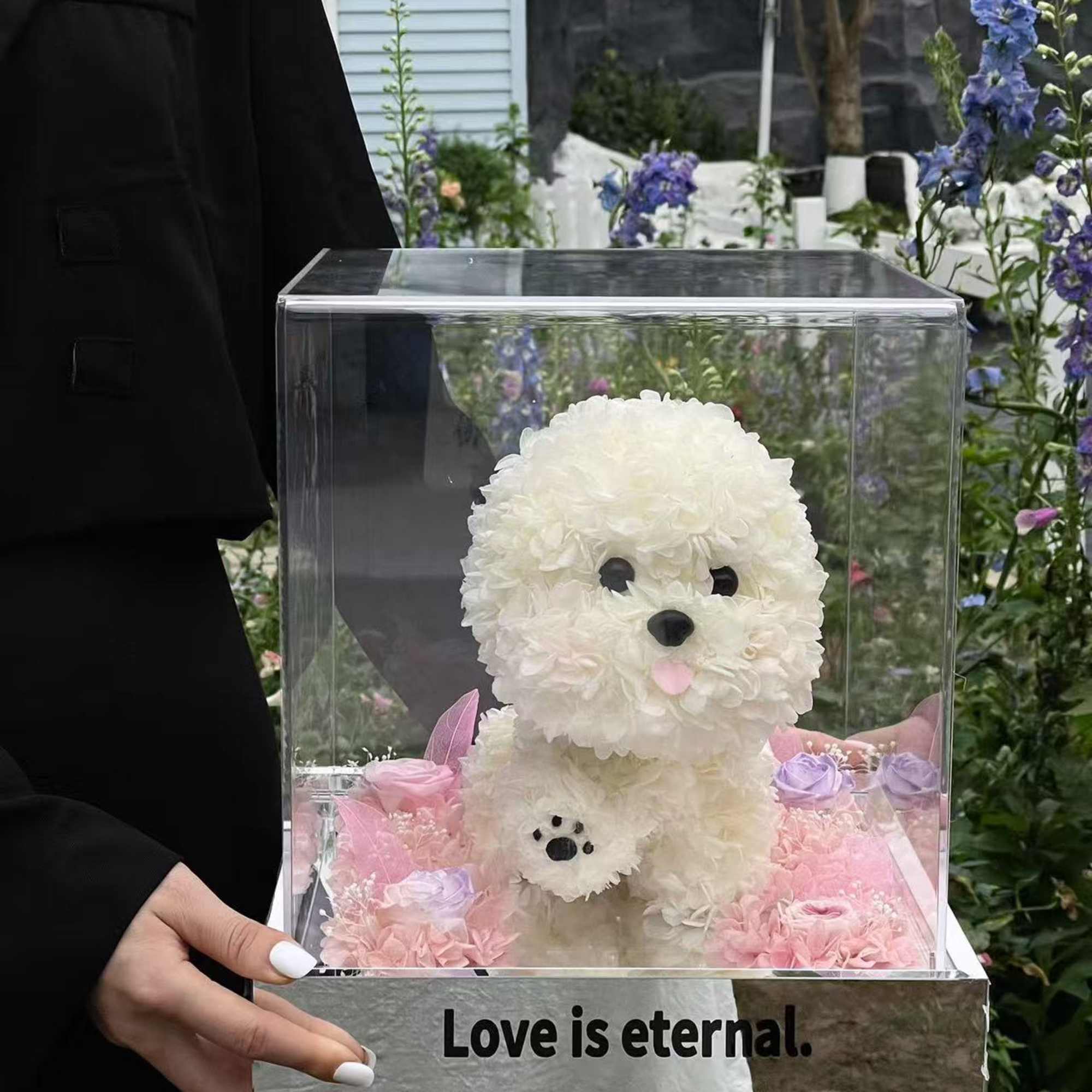 A charming preserved flower arrangement handcrafted into a puppy silhouette, symbolizing loyalty