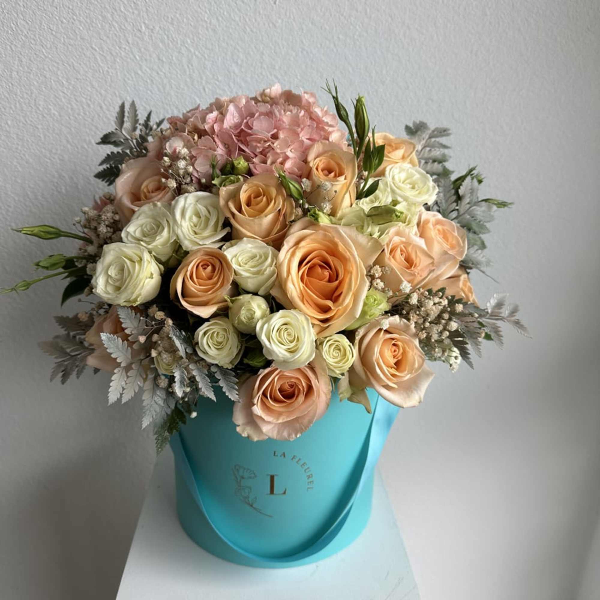 This romantic arrangement includes roses, spray roses and greens.

Perfect for any occasion.
You