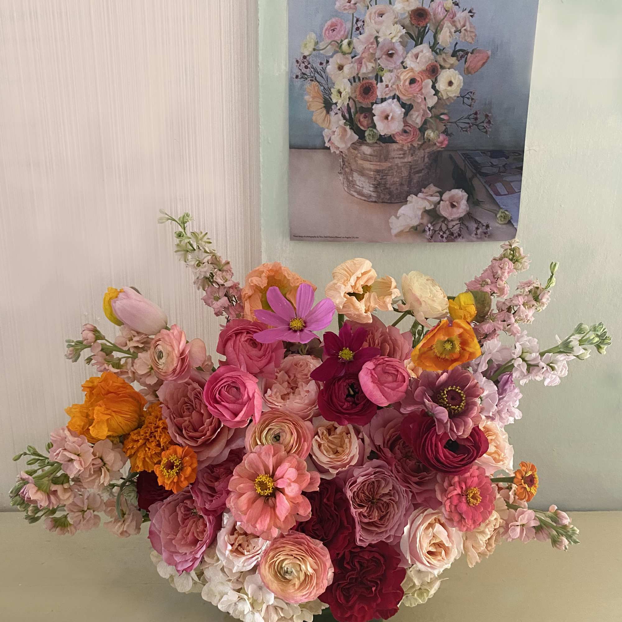 Vibrant and colorful arrangement with a mixed pallette of red, pink, orange