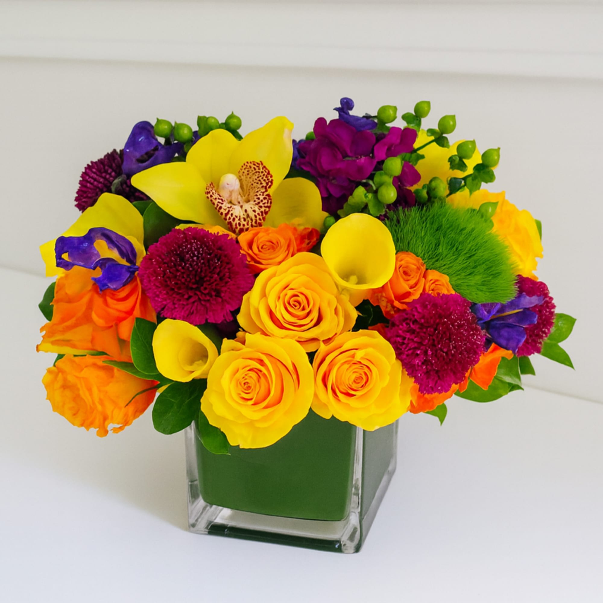 This classic colorful arrangement is presented in a 6" cube vase. It