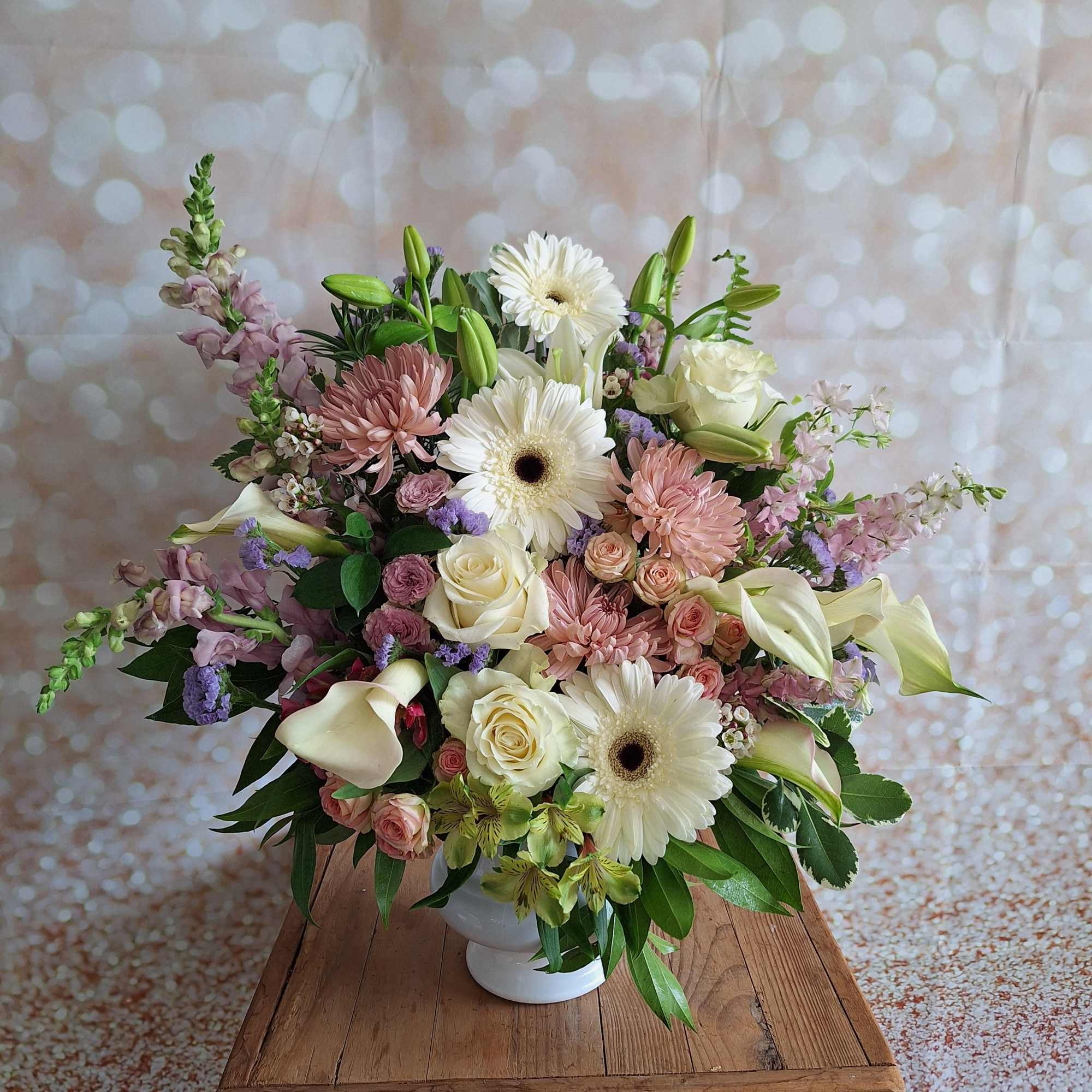 Rich and elegant, this all-red arrangement is a wonderful remembrance for your