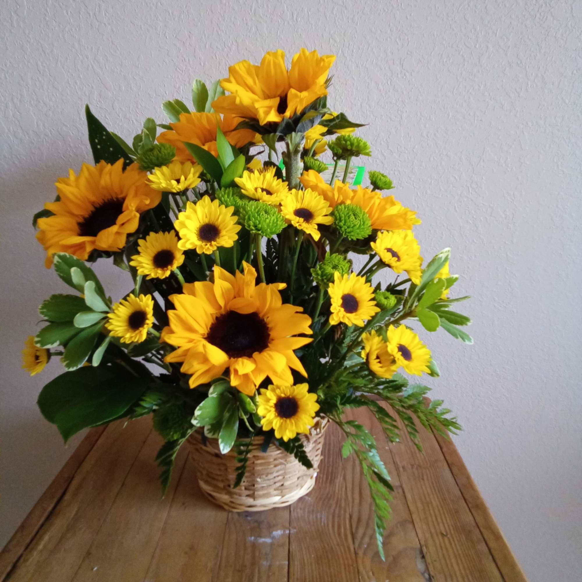 This Sunflower basket with white and yellow daises and sunflowers, is the