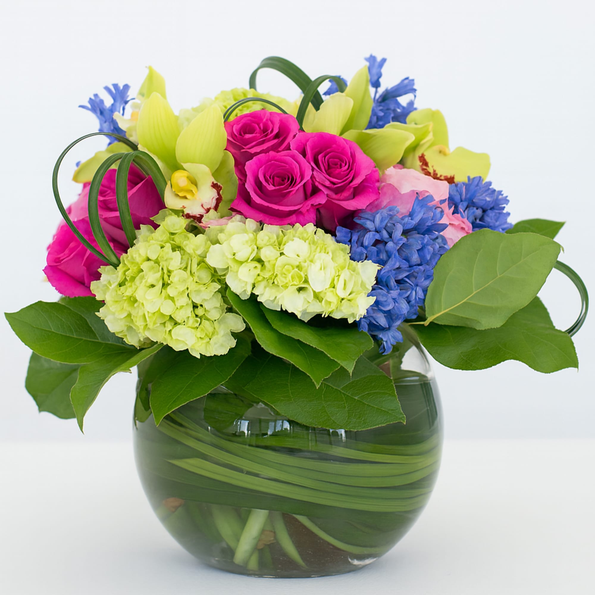 A sweet collection of Roses, Orchids, Hydrangea and more, enhanced with loops