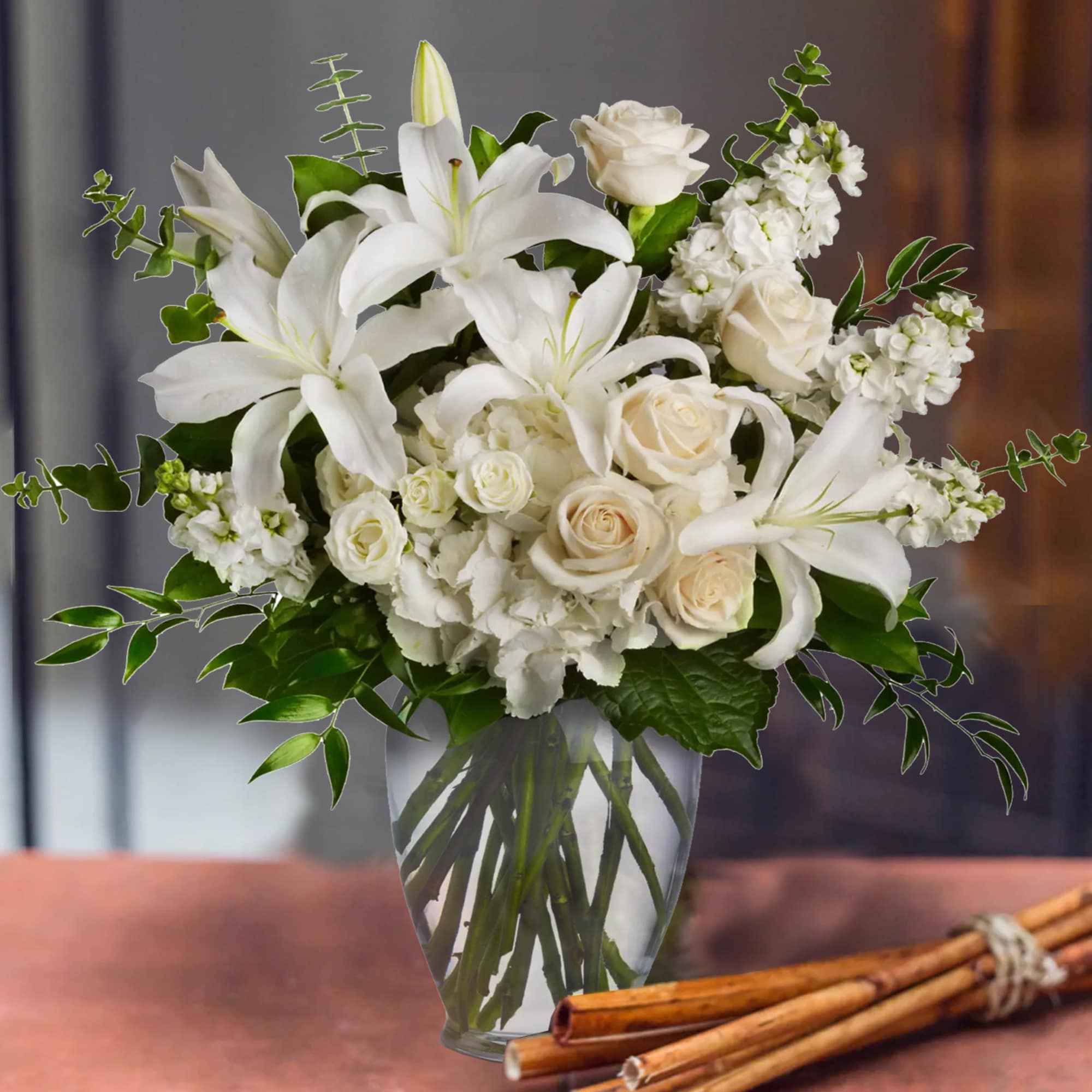 A lovely bouquet to soothe and comfort. A variety of white blossoms