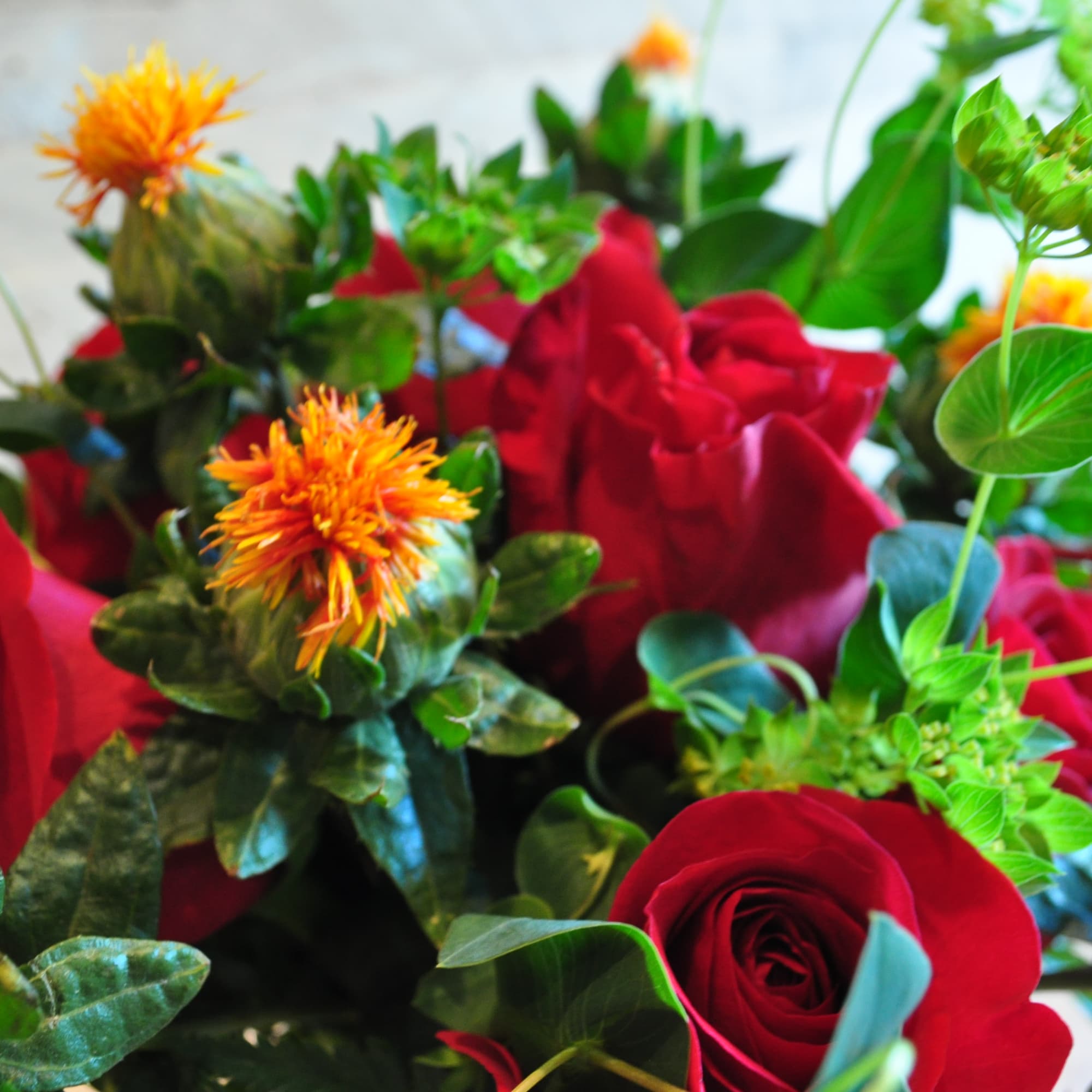 Not your everyday dozen roses. Unique accents and bespoke designs 

This arrangement