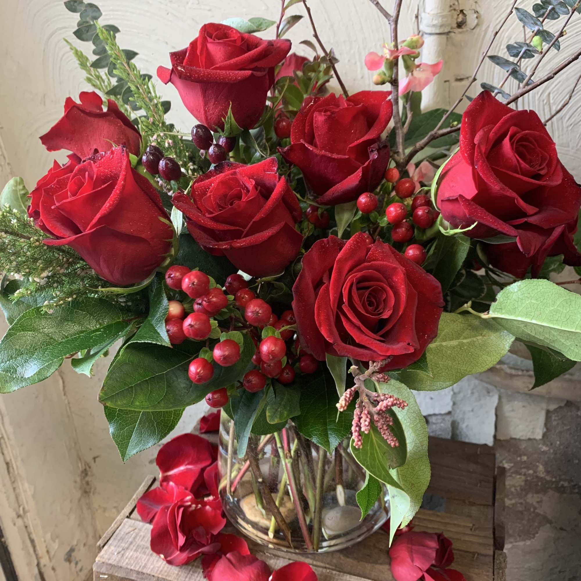 These red roses with hypericum and eucalyptus are classic! A perfect traditional