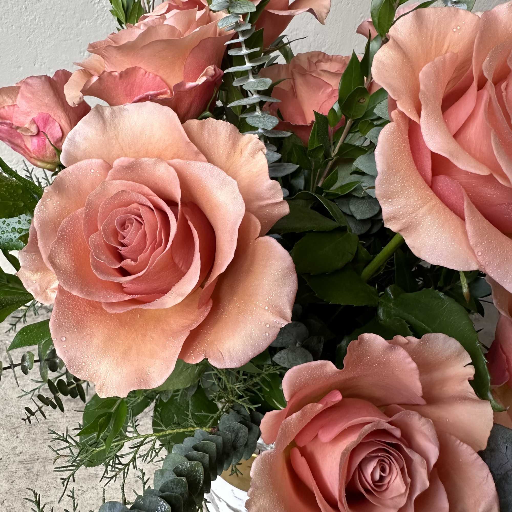 Gorgeous full headed peachy-mauve roses. Standard (12 count/1 dozen), Deluxe (18 count)