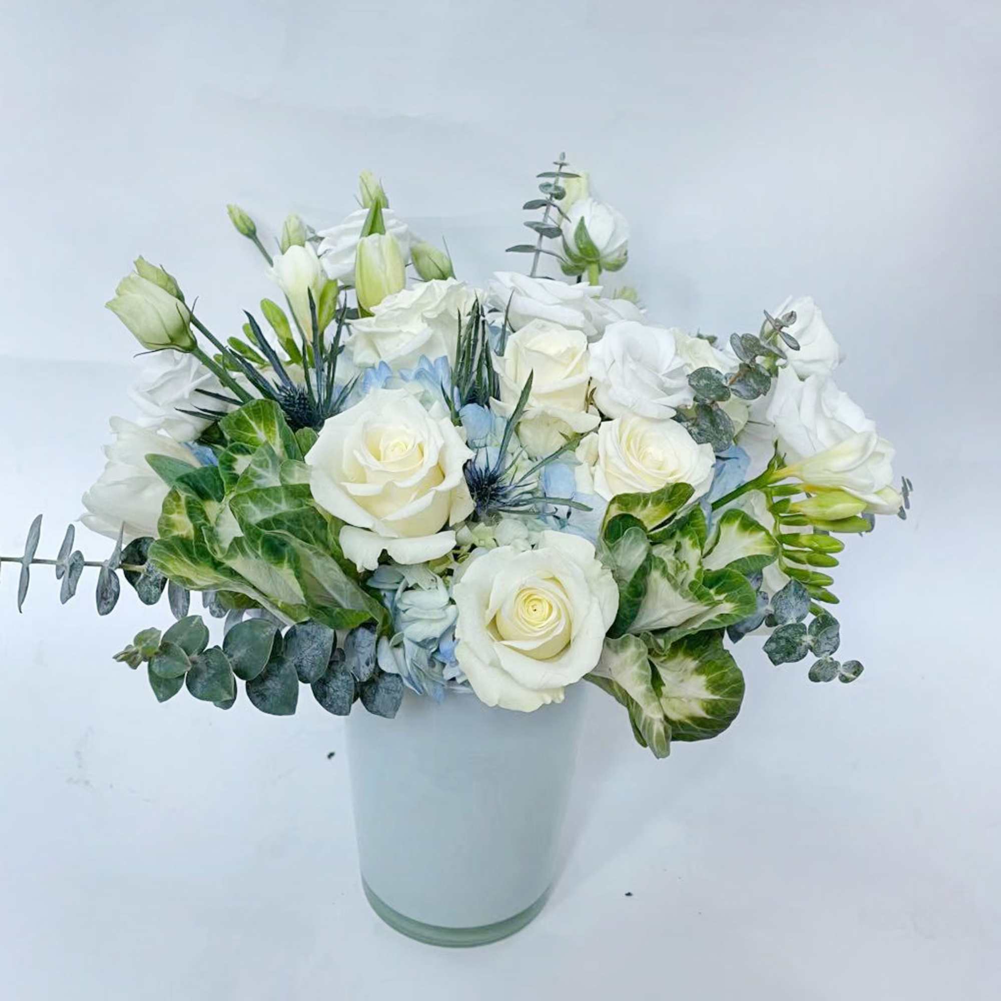 Drift into calm with Ocean Breeze, a serene floral arrangement inspired by