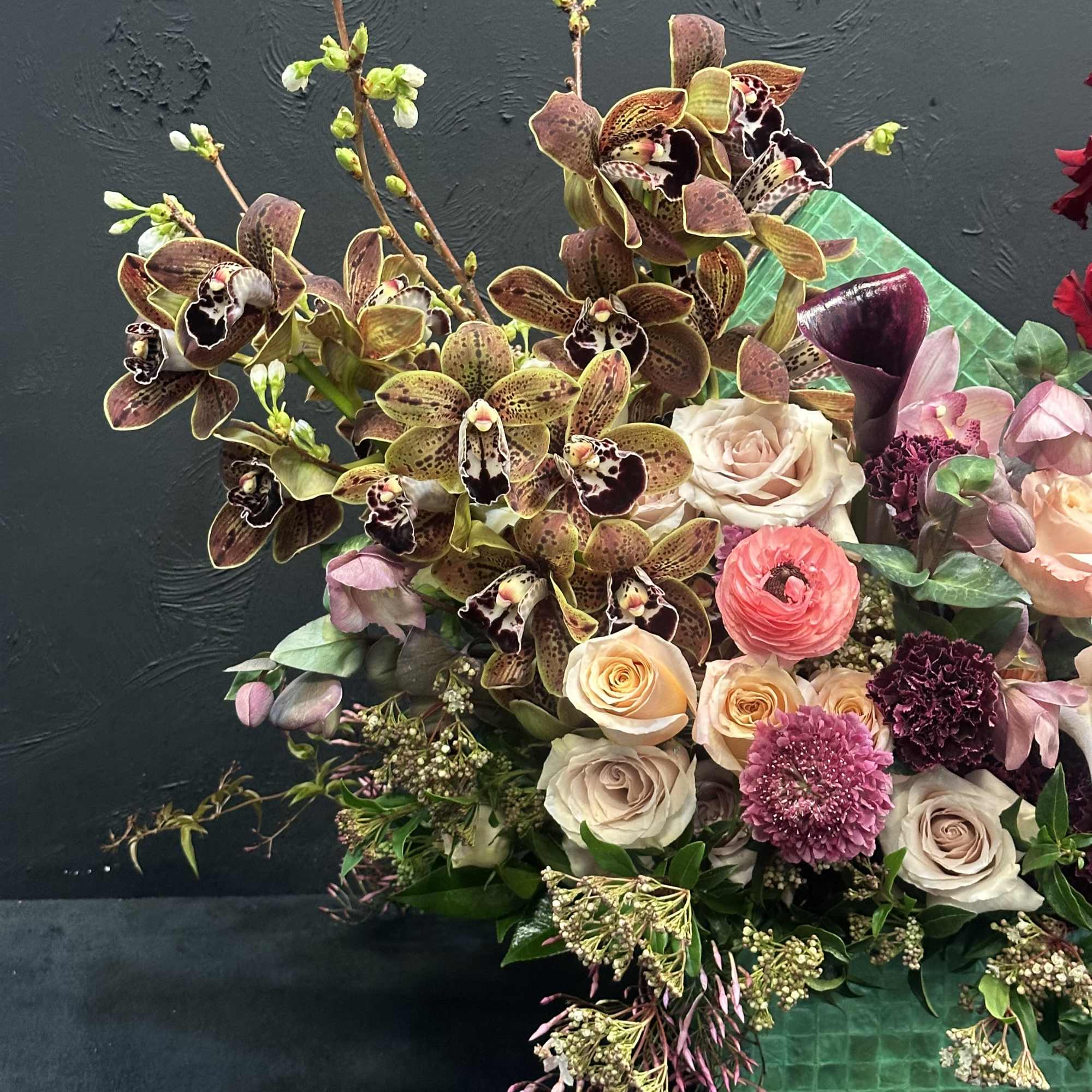 Enchanting Elegance embodies the epitome of floral sophistication. At its heart, pristine