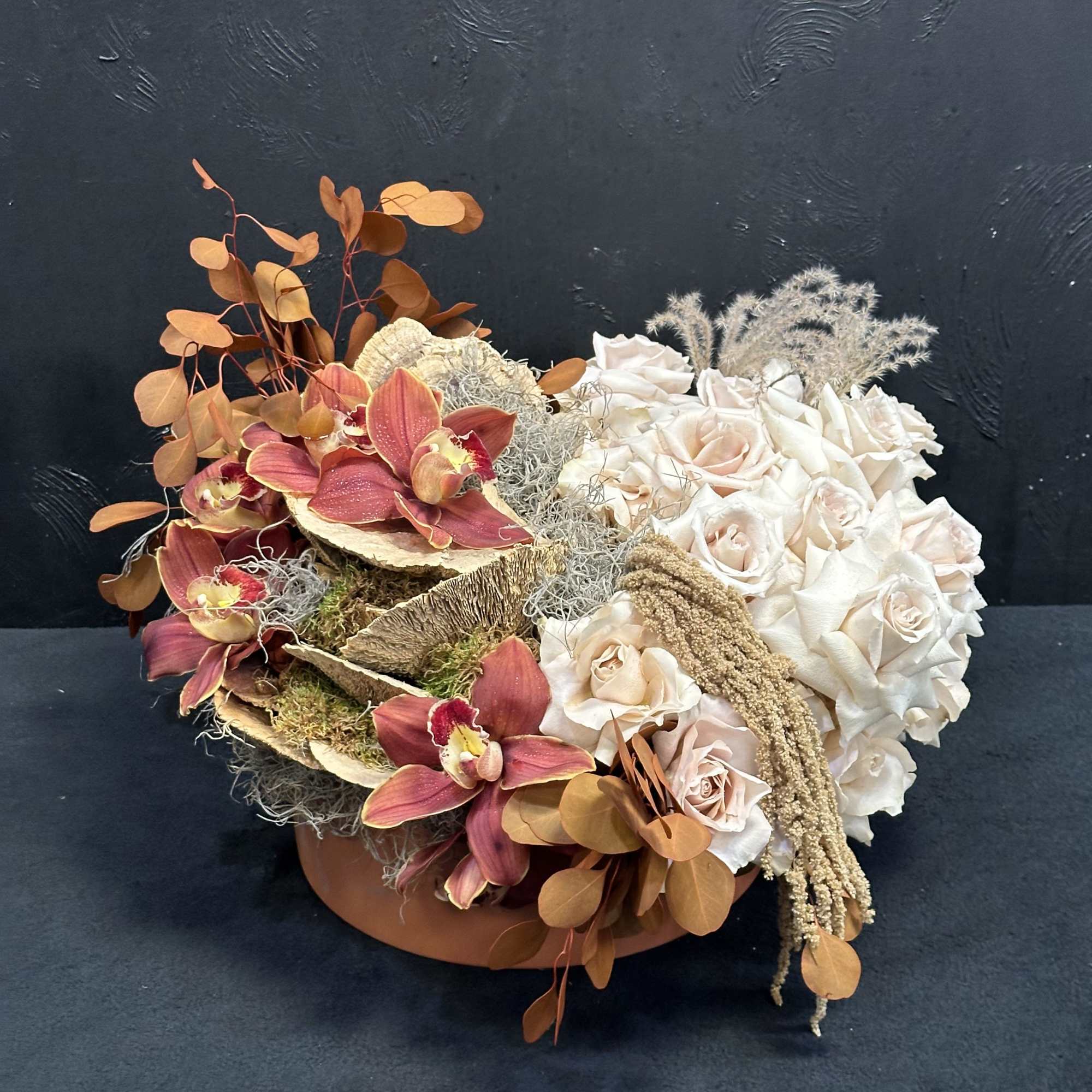 A beautiful blend of cymbidium orchids and soft quicksand roses, Orchid Grove