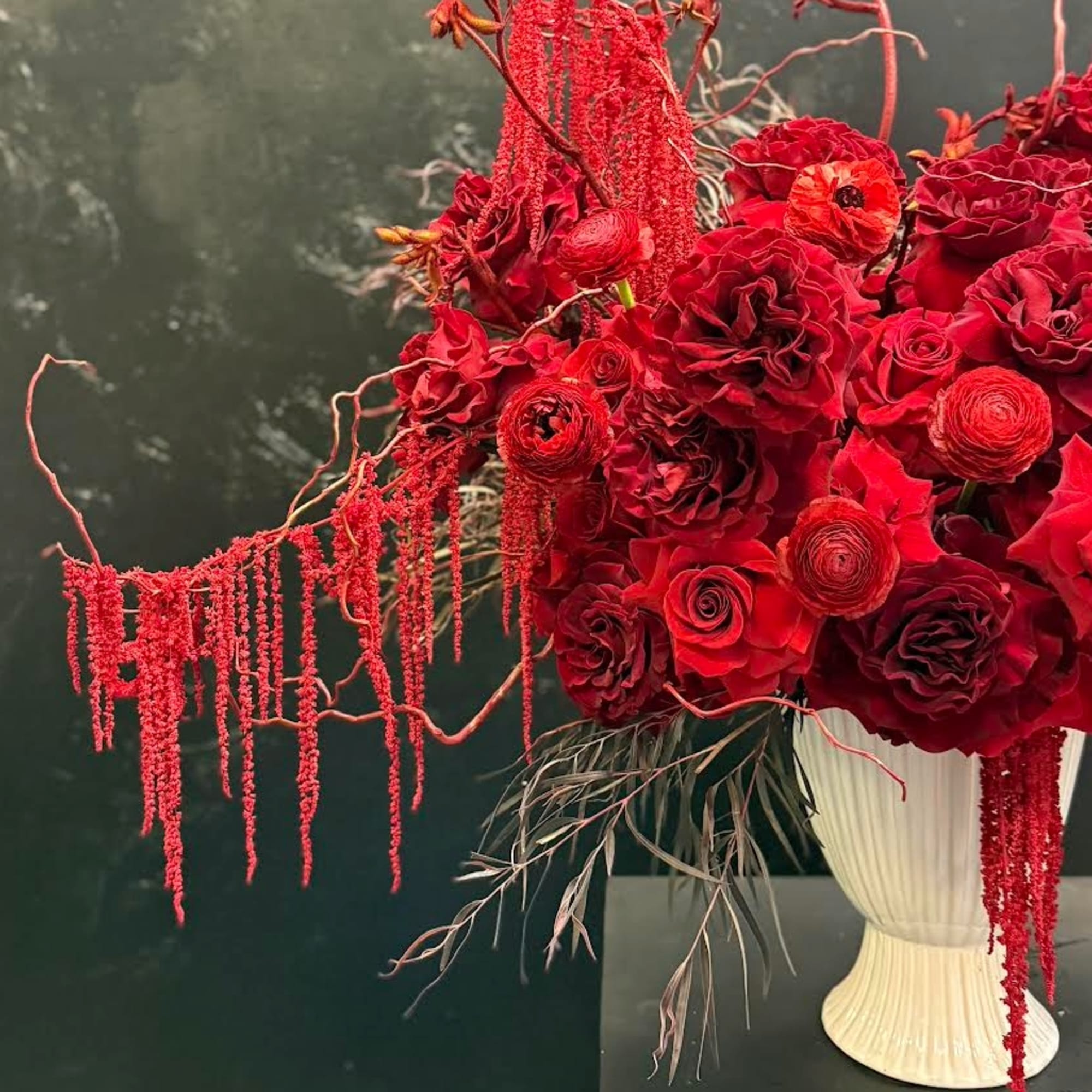 A beautiful mix of rich red flowers arranged with timeless elegance, Scarlet