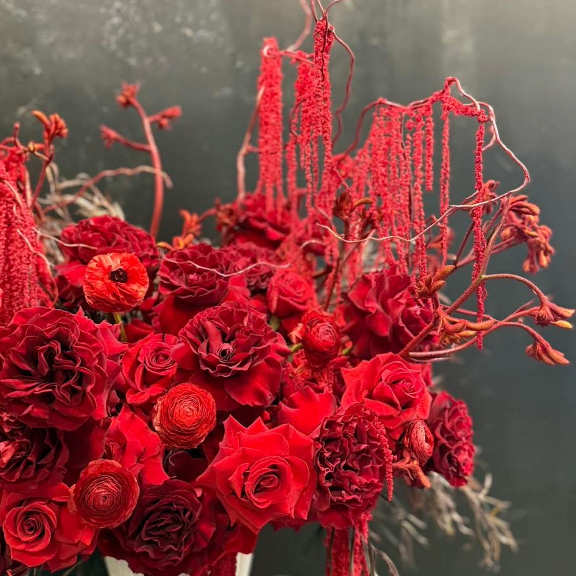 A beautiful mix of rich red flowers arranged with timeless elegance, Scarlet