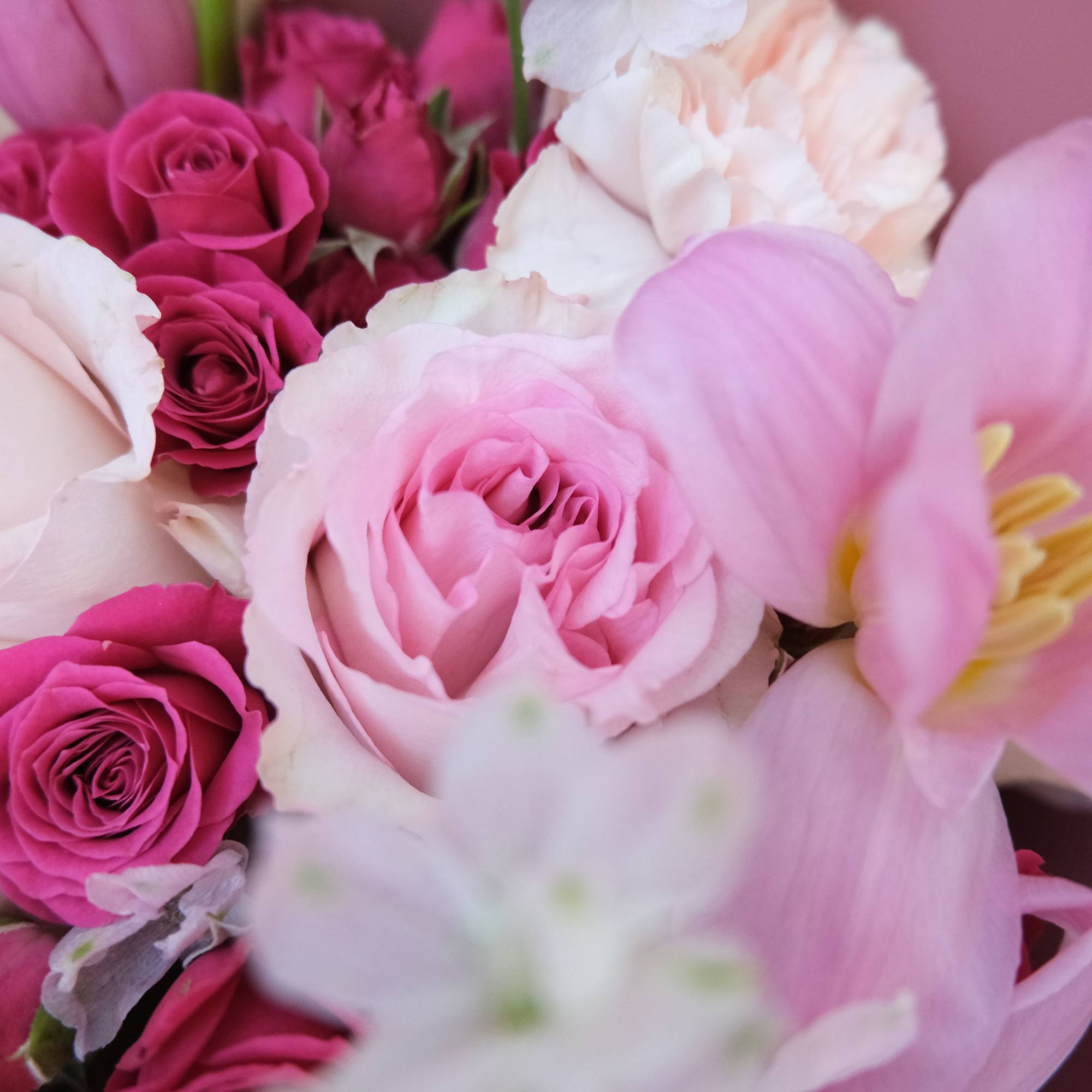 Tulips for tenderness, roses for romance &mdash; wrapped together in a bouquet