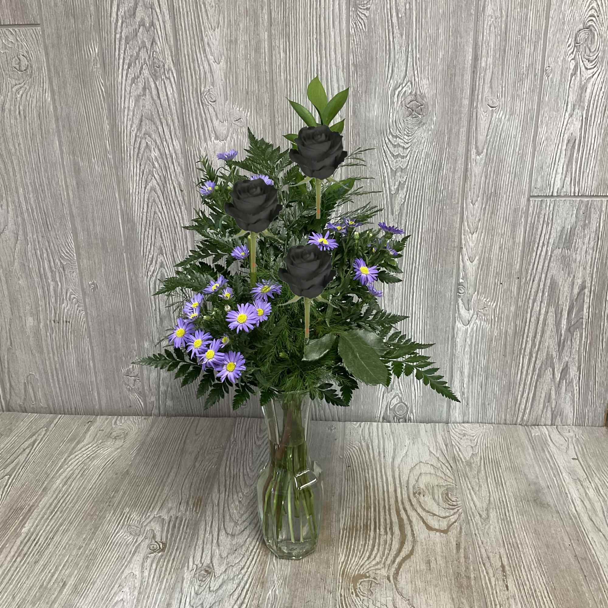 Special available Valentine&rsquo;s week. An enhanced black rose in a bud vase.