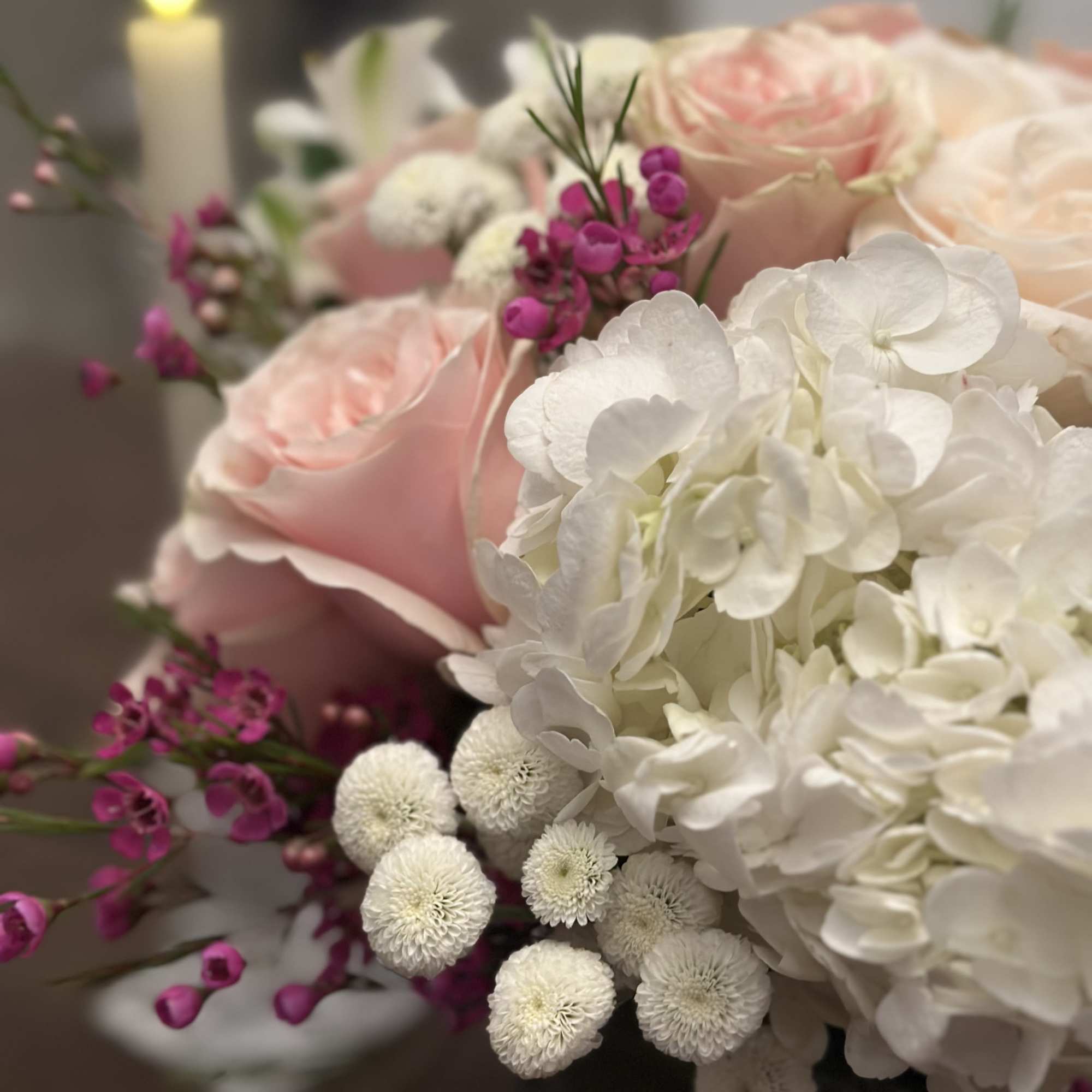 A light and lush arrangement perfect for a centerpiece or just because.