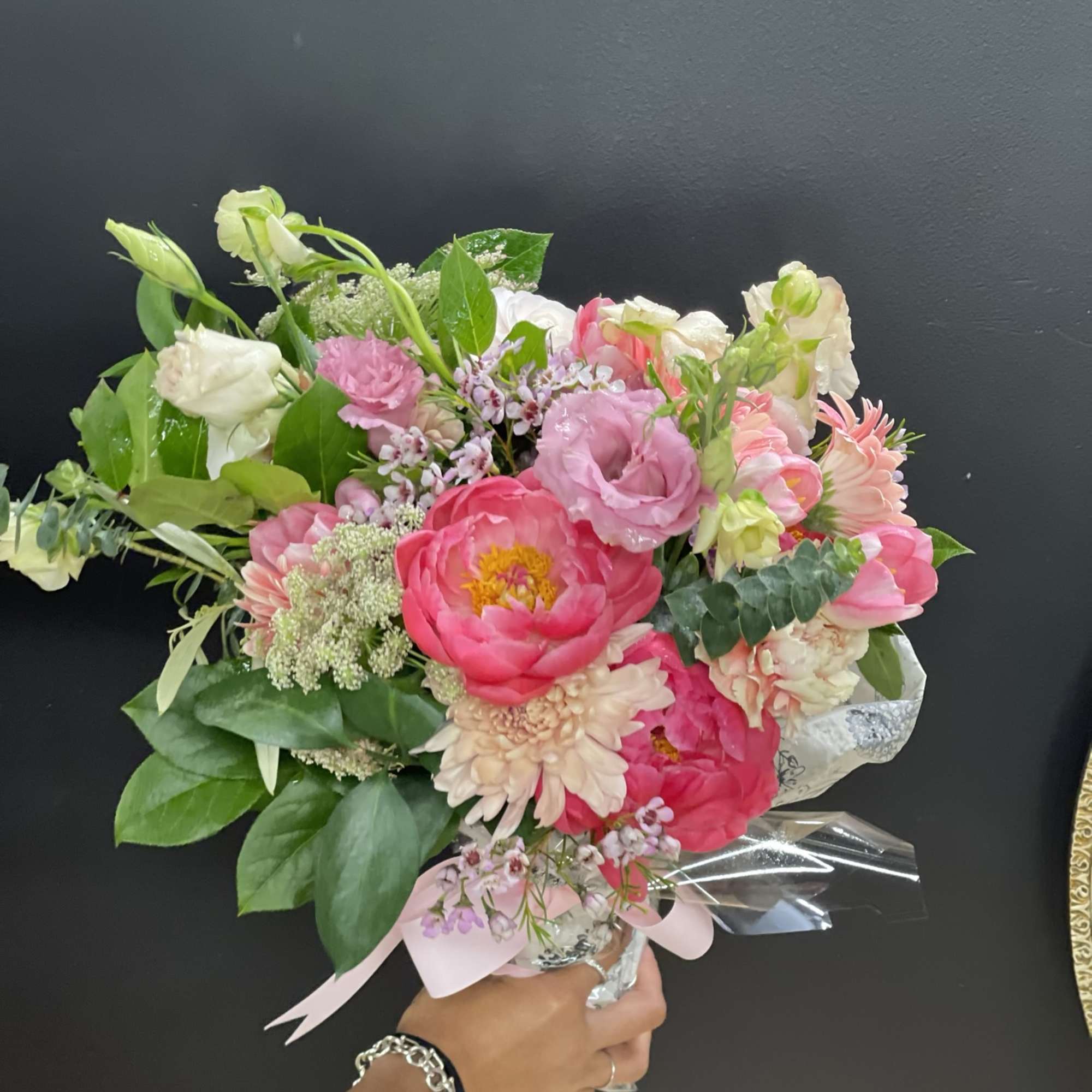 Beautiful Designers Choice custom seasonal  floral bouquet wrapped and adorned with