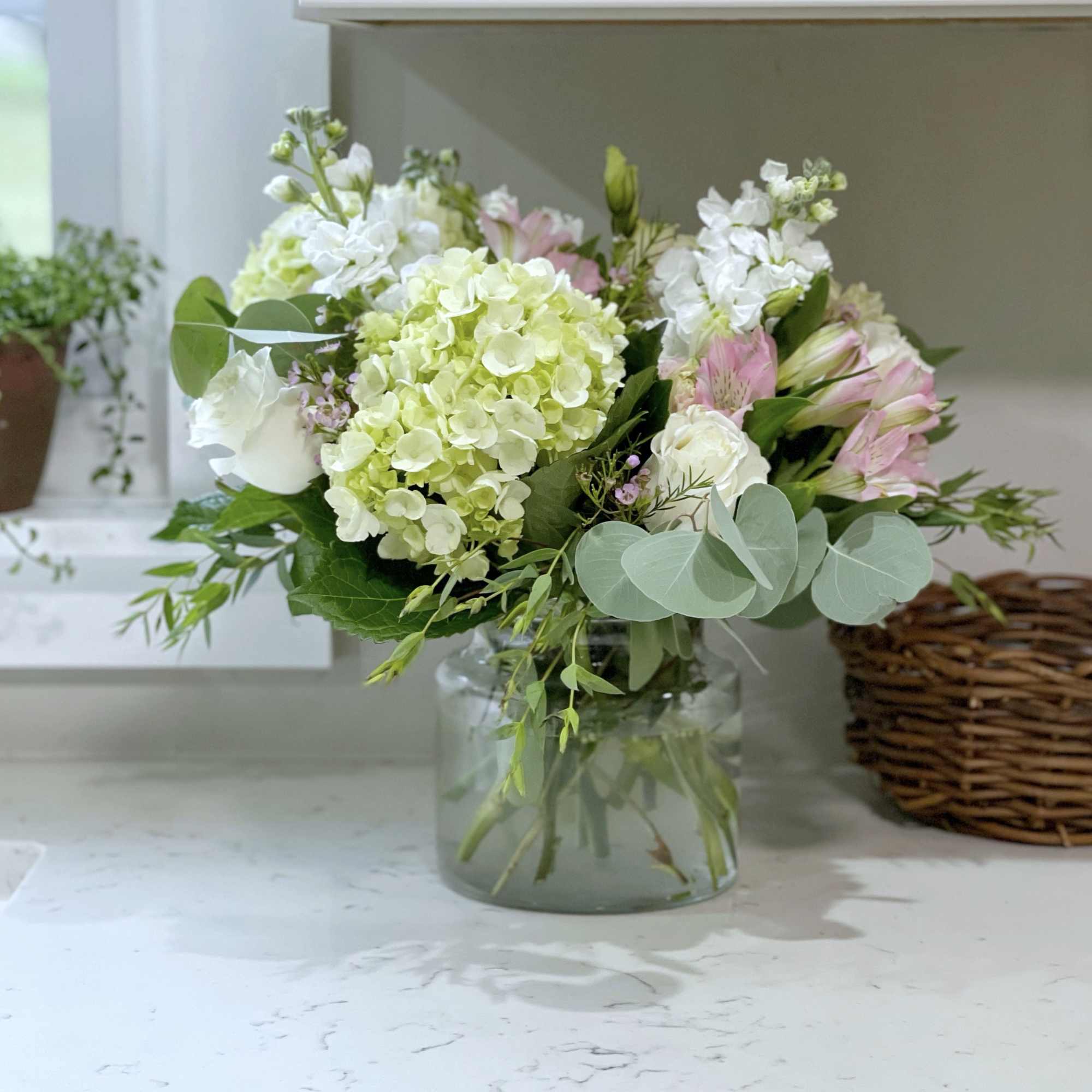 Gift them this lush bouquet in a soft palette, suitable for any