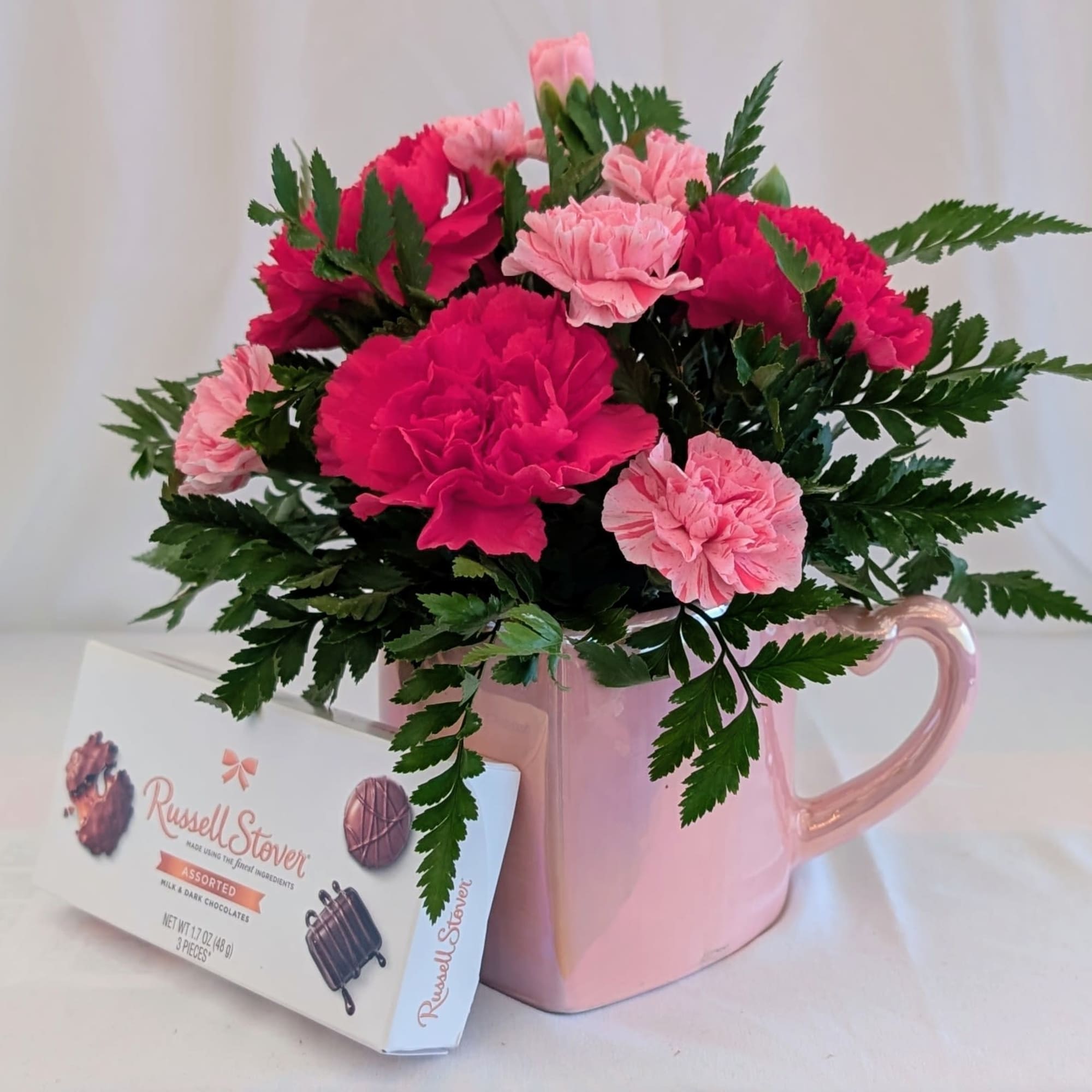 A charming burst of pink perfection! This sweet arrangement features fresh pink