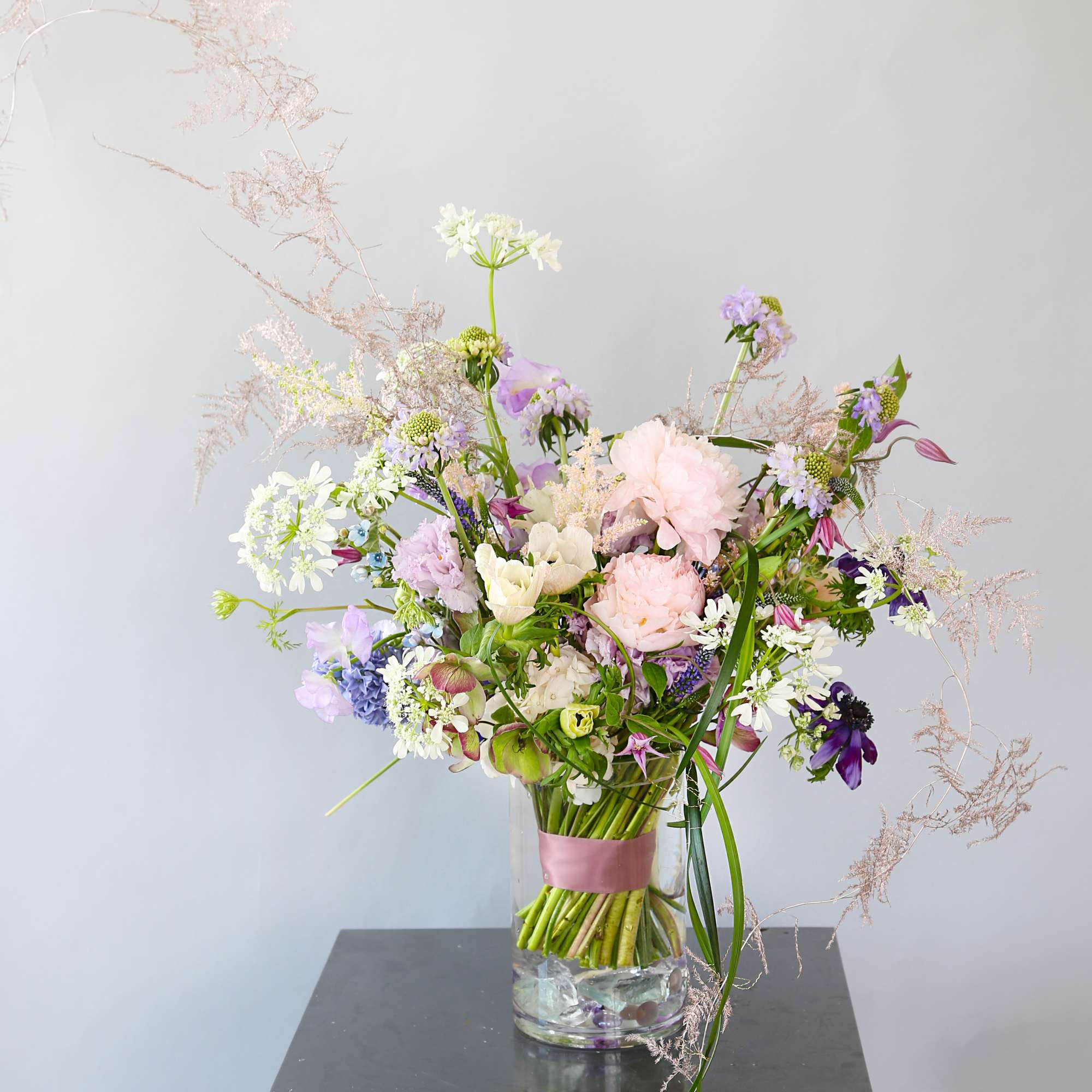 A soft Blush Ivory color palette create with Peony, Anemone, and seasonal
