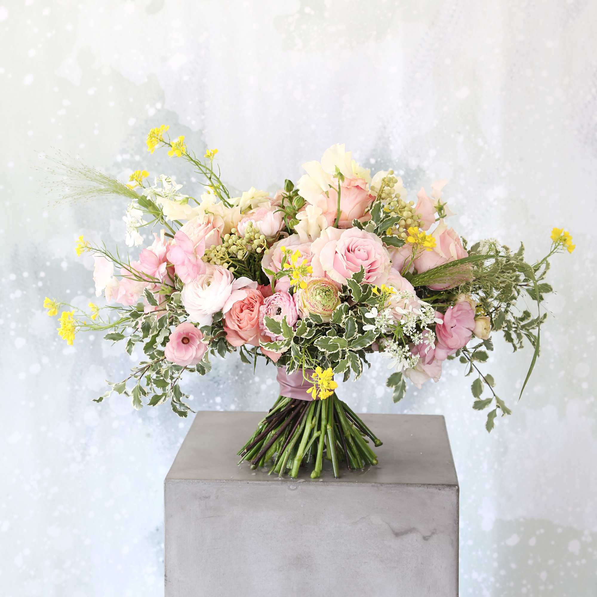 A fan shape hand tie bouquet create with soft pink, pastel color