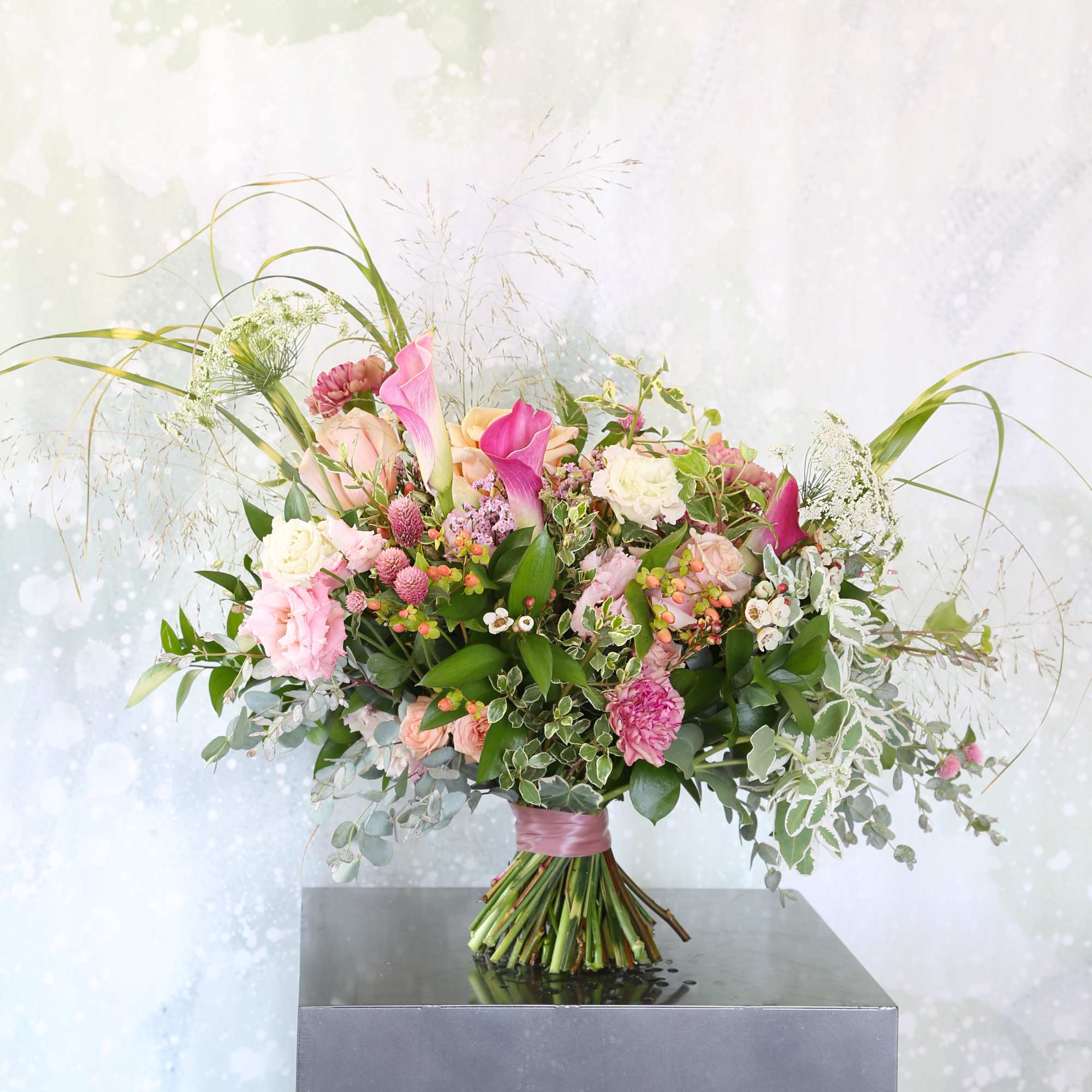 A Luxury Mix Boquet arrange with garden Rose, Calla lillies, Lisianthus, carnation