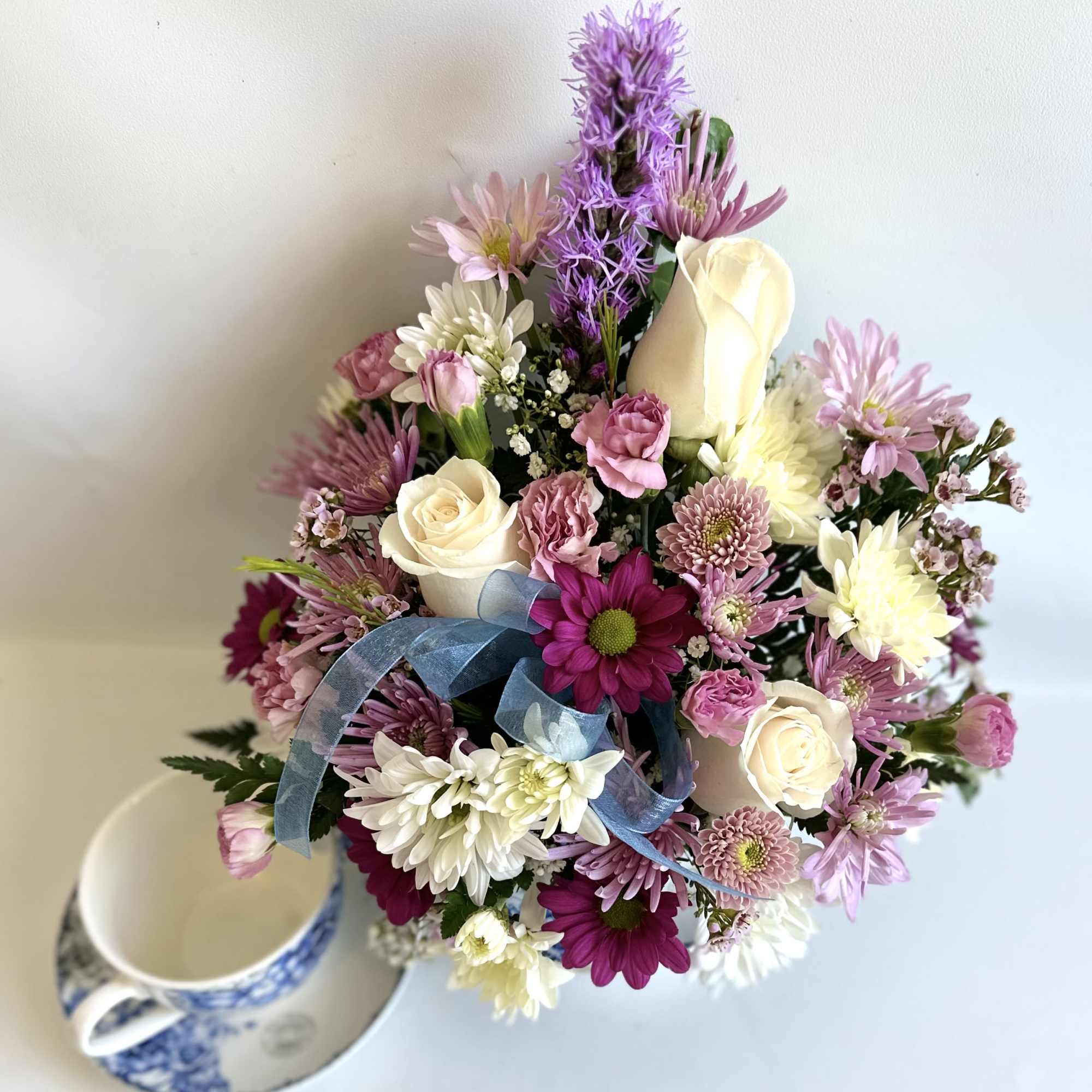 Teacup with a Blue English Rose design filled with a nice mix