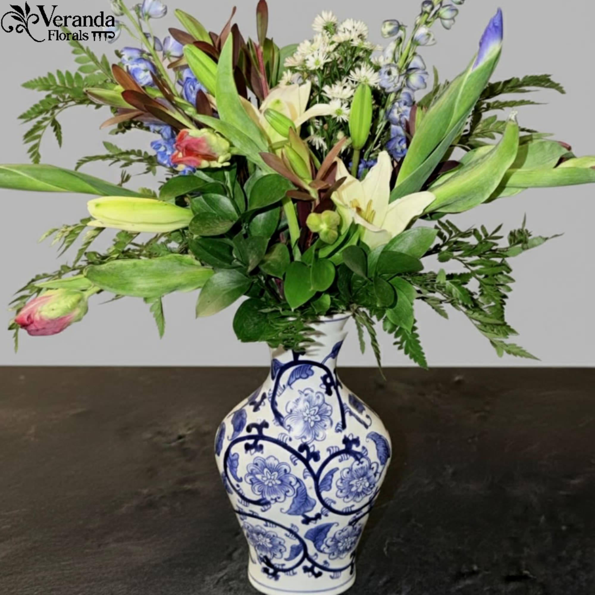 This elegant porcelain vase features a classic baluster silhouette, tapering gracefully to