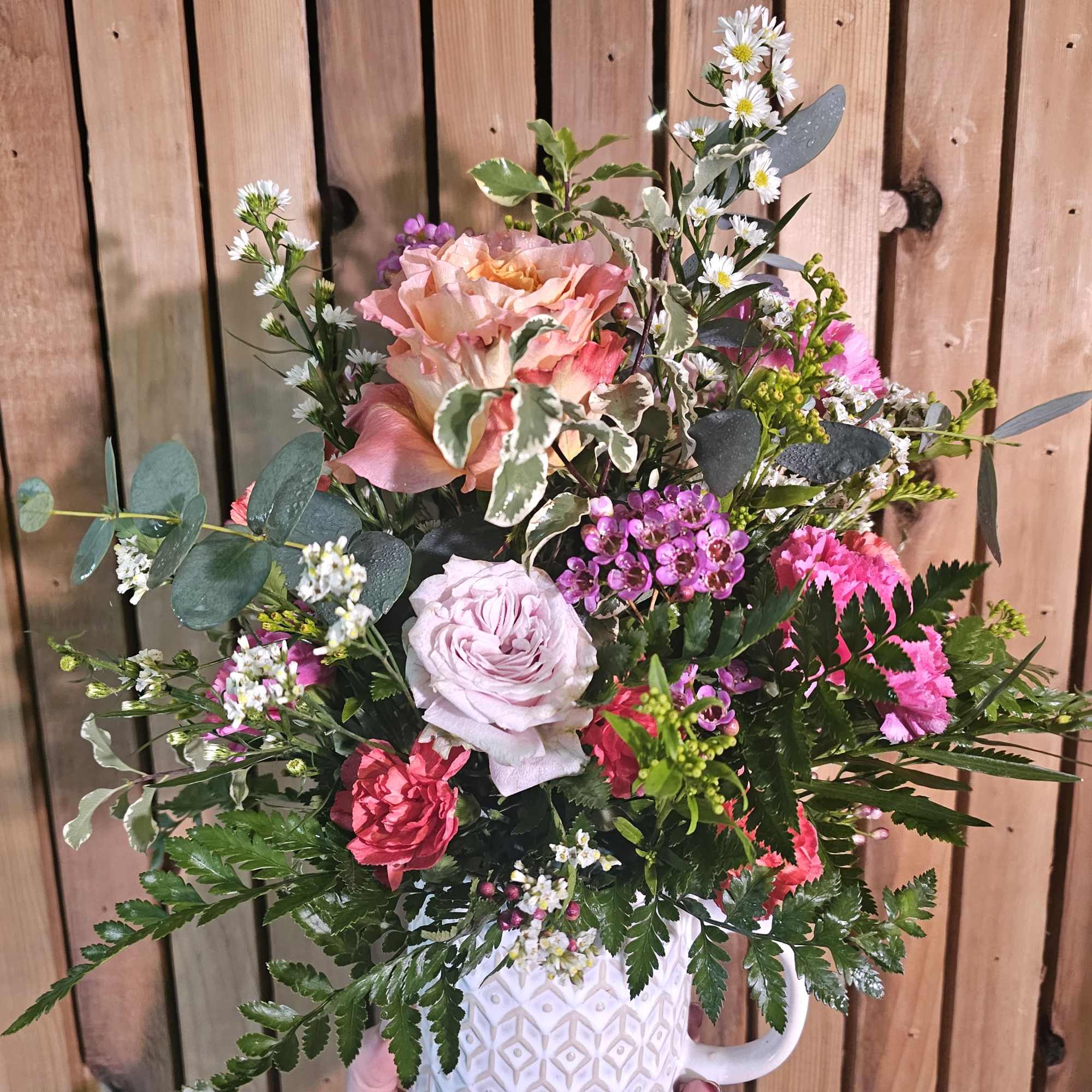 Beautiful petite bouquet in a unique and usable mug. Makes a great