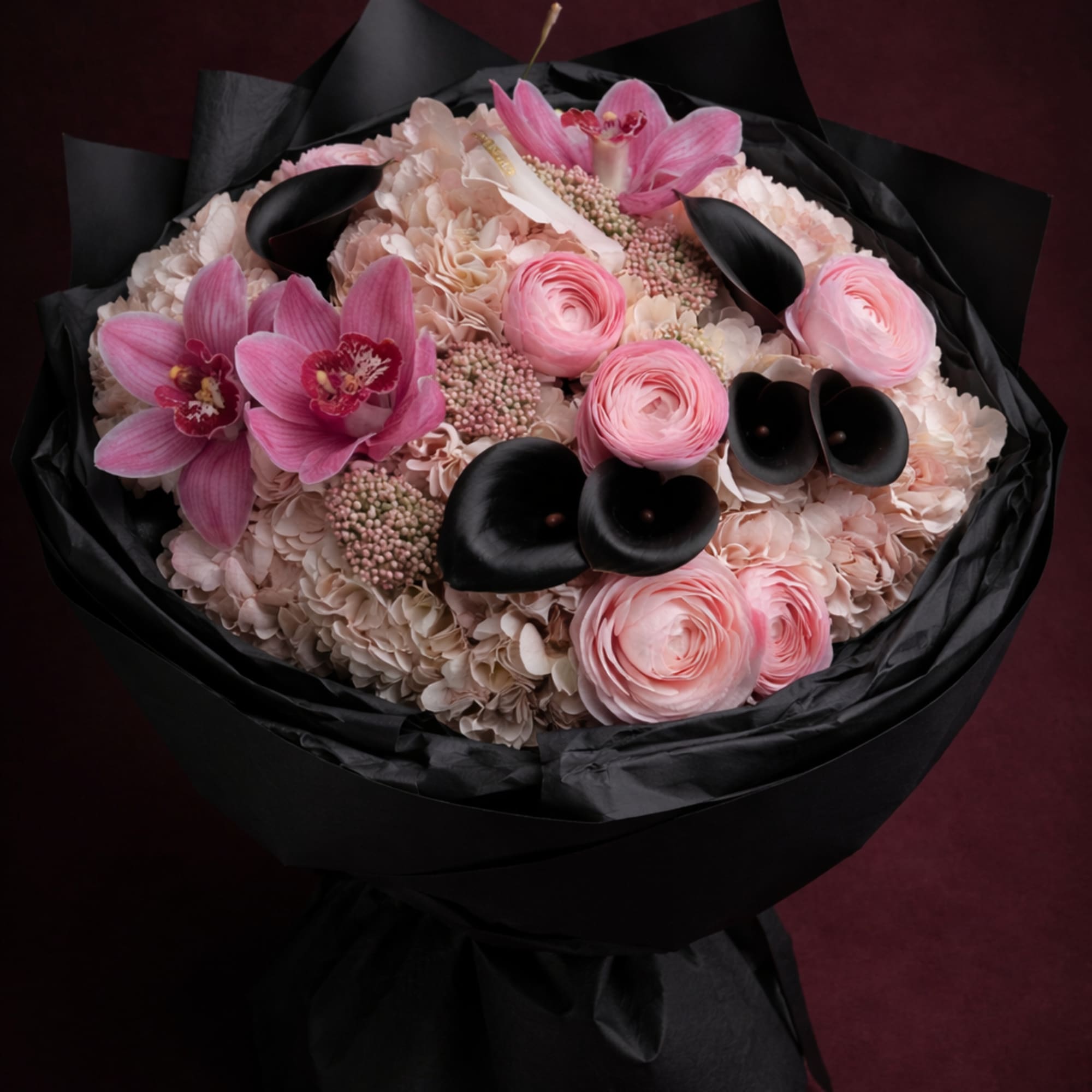 Noir Blush Couture is a bold, editorial-style bouquet that blends soft romance
