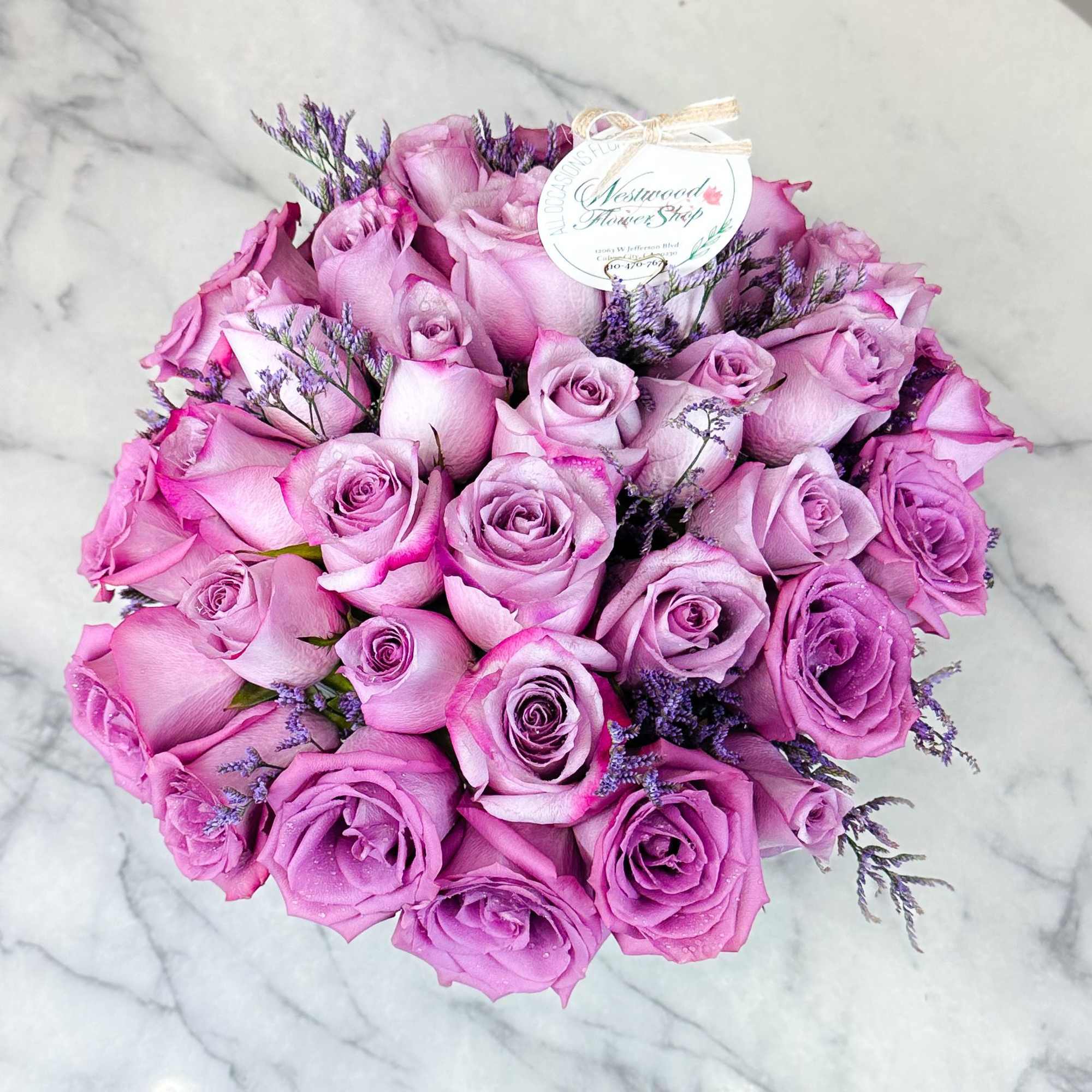 Luscious 2 dozen Ecuadorian lavender roses with chic and modern design arranged
