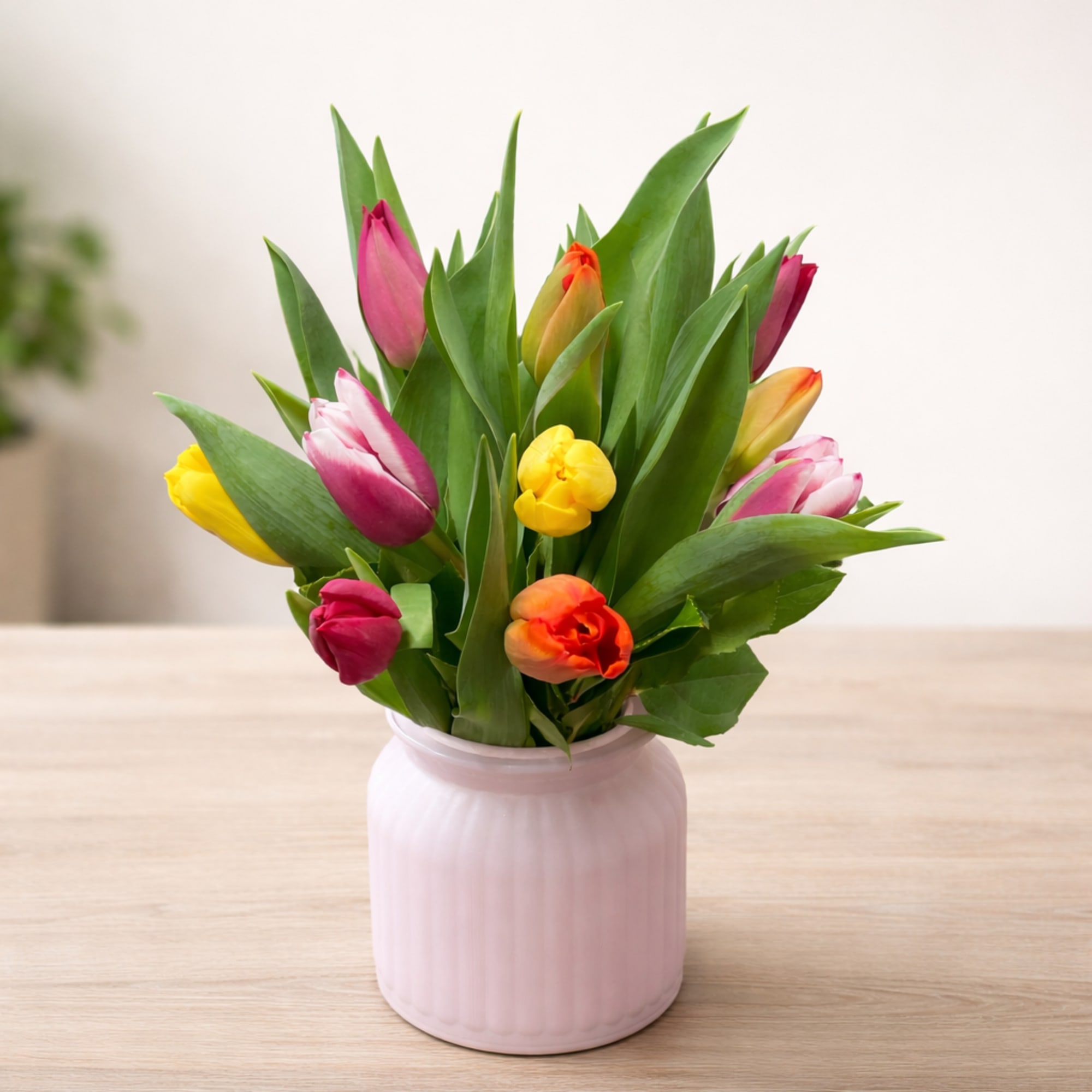 Bright, cheerful and effortlessly charming, this arrangement features tulips in a joyful