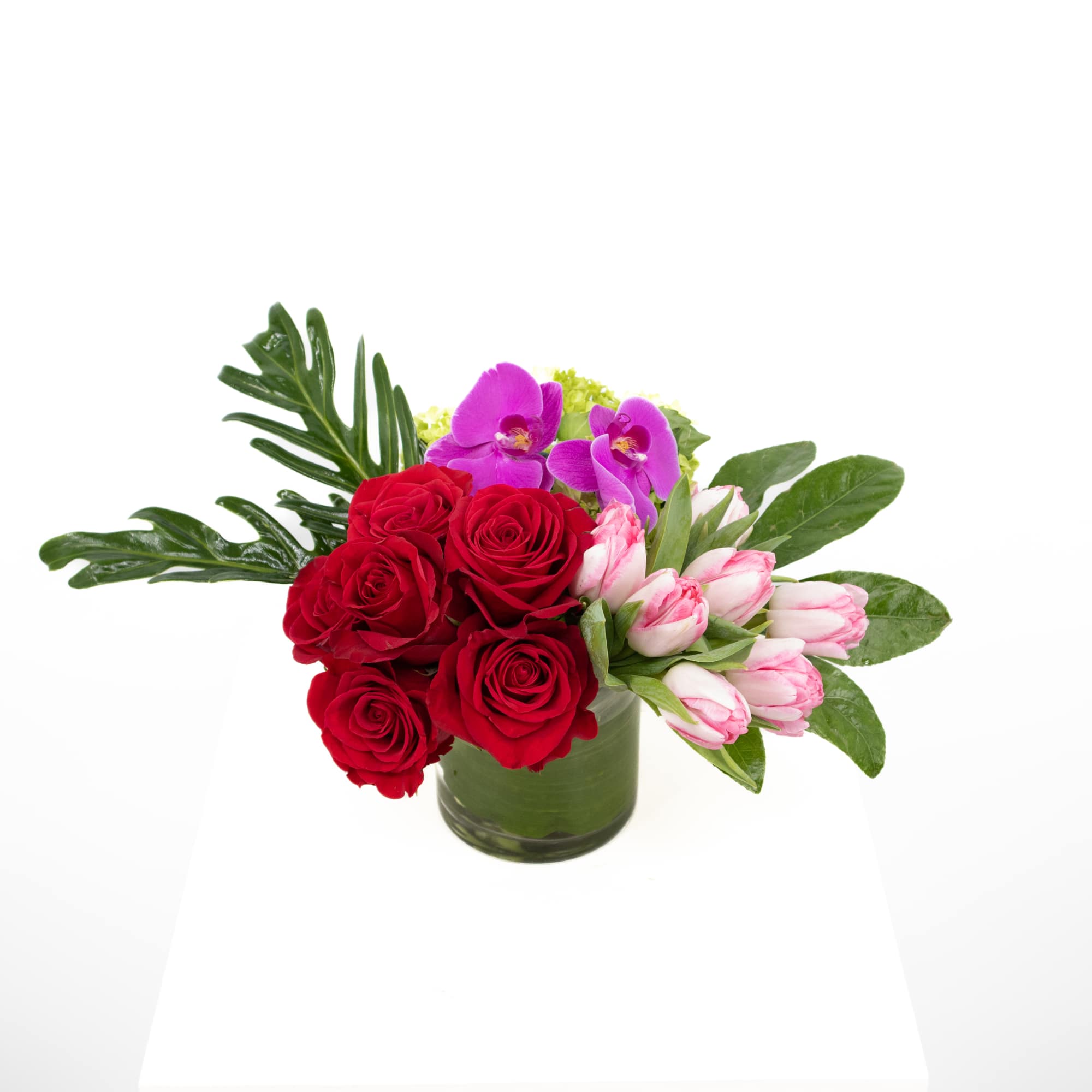 This stunning arrangement that includes gorgeous roses of your color preference along