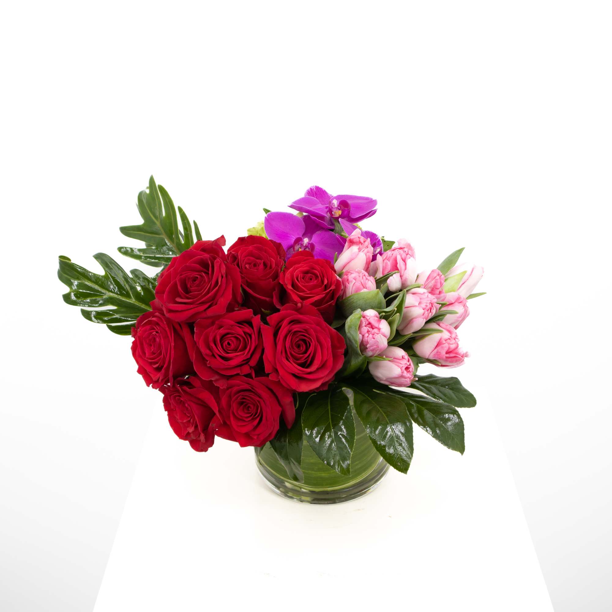 This stunning arrangement that includes gorgeous roses of your color preference along