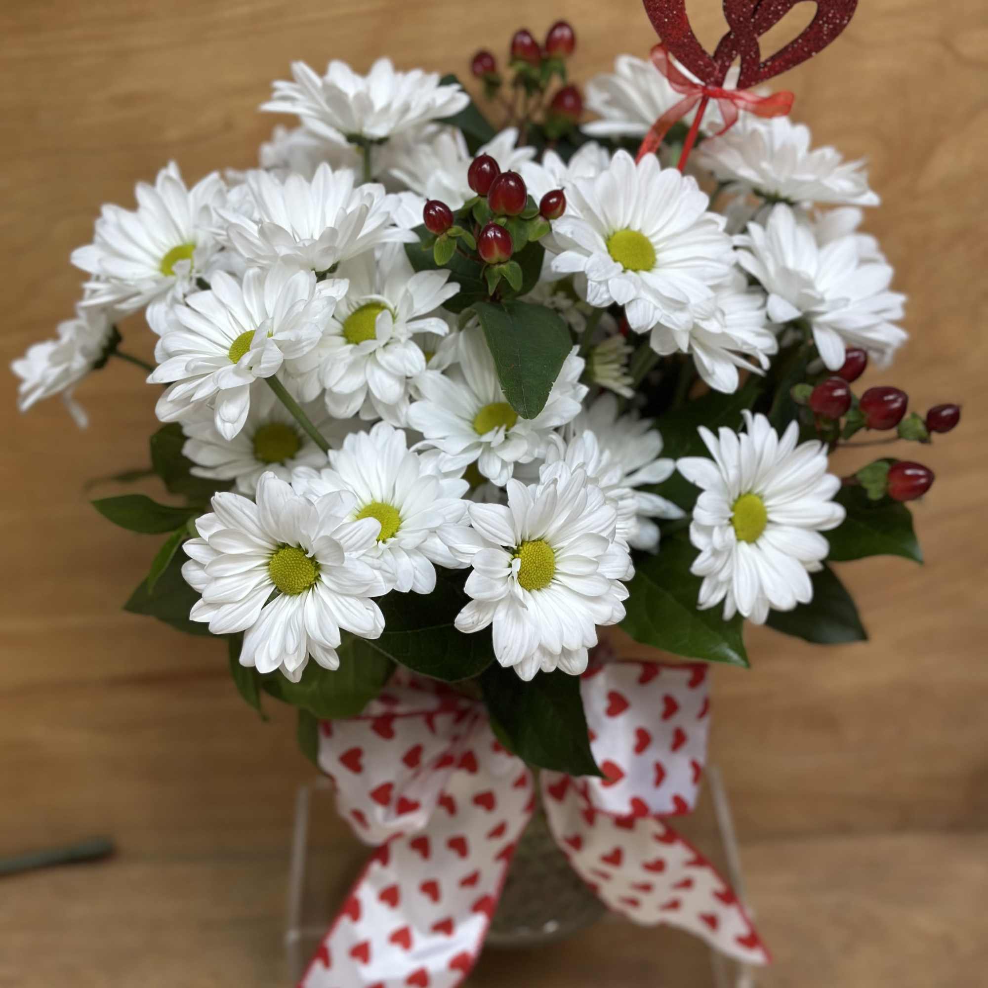 This sweet arrangement is perfect for any Valentine.., white daisies ,red berries