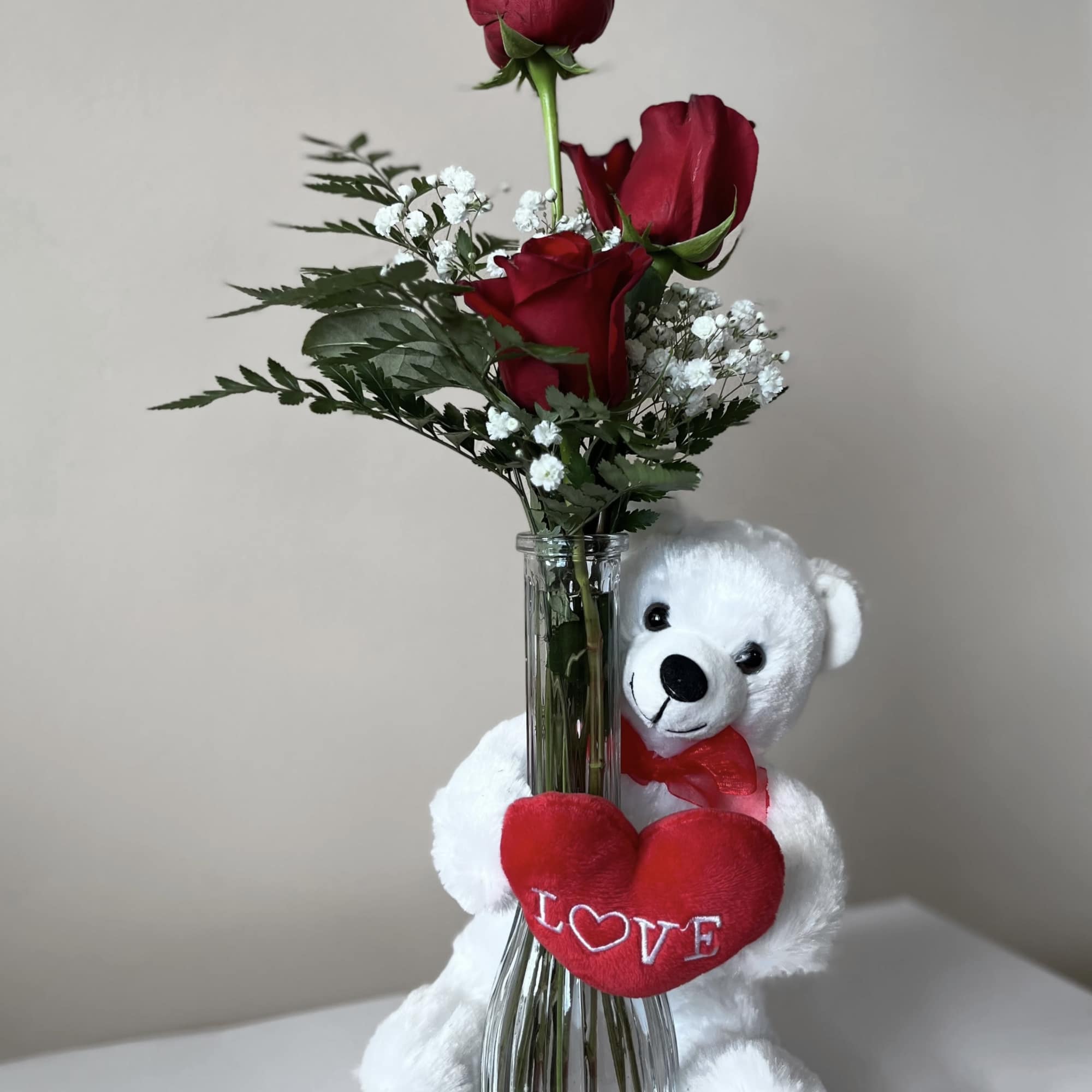 Embrace your feelings with a classic gift of long-stem red roses. Displayed