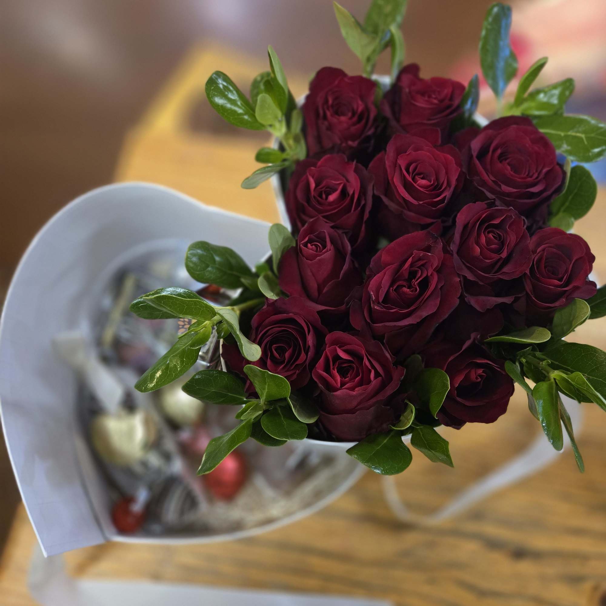 Our heart shaped box is filled with one dozen roses and an