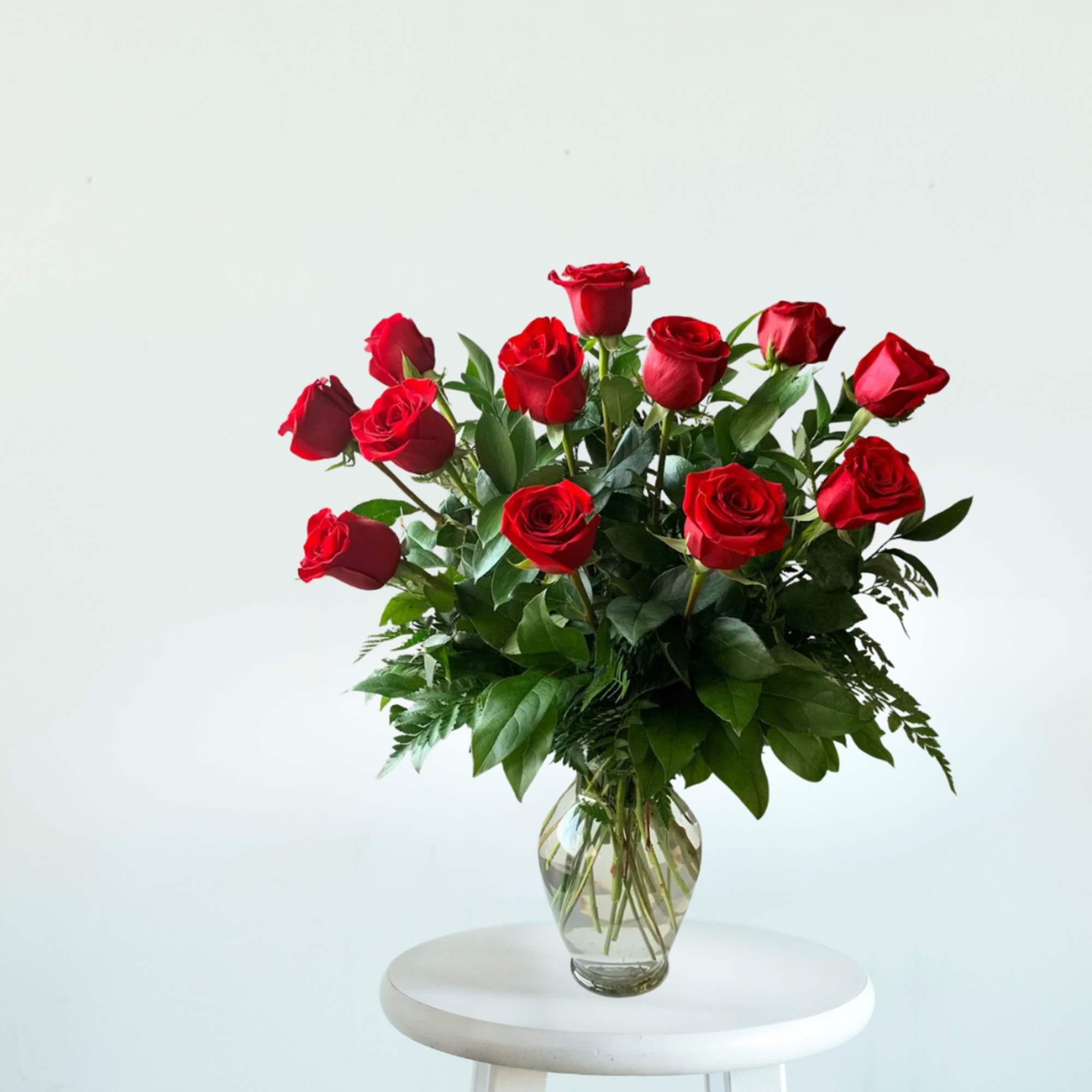 Timeless, elegant, and effortlessly romantic. Our Classic Rose Vase Arrangement features fresh