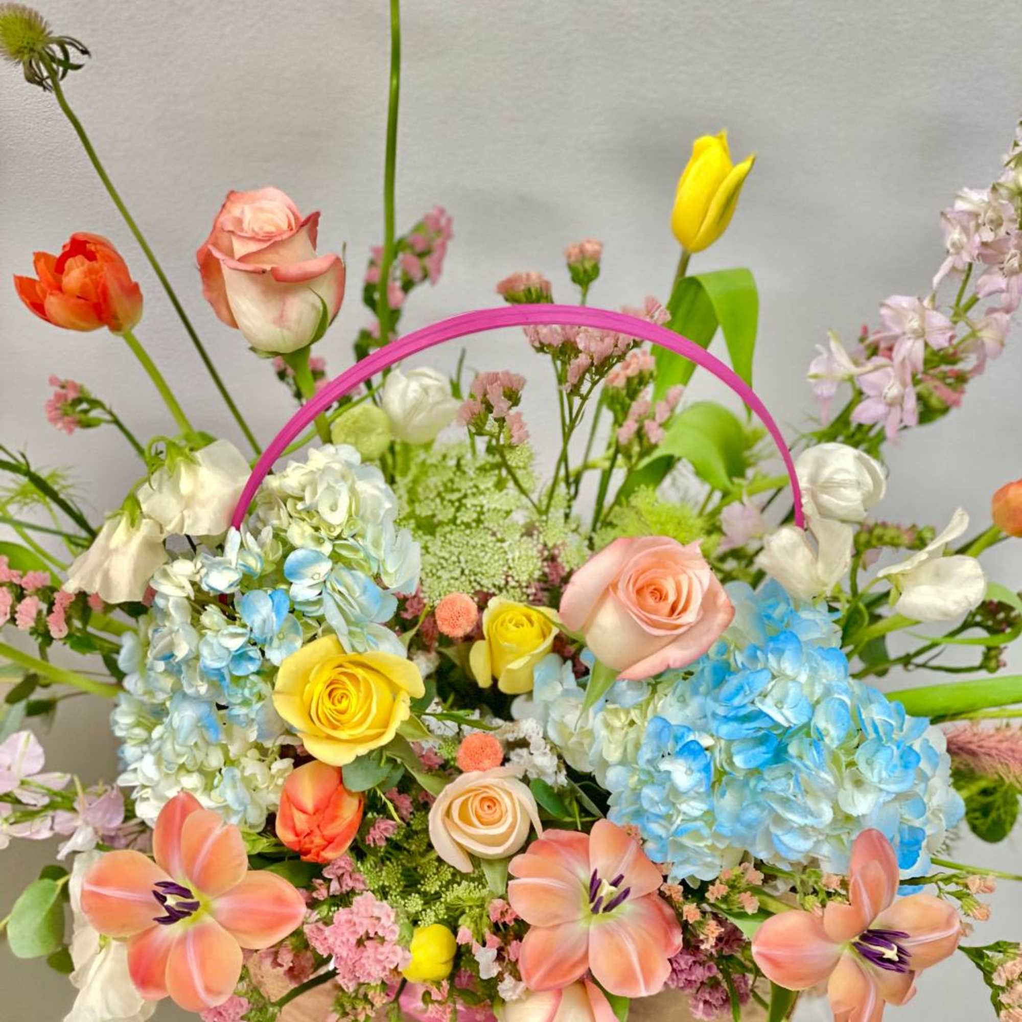 Theme Colors: Shades of peach and yellow in a basket 

Featured Blooms: