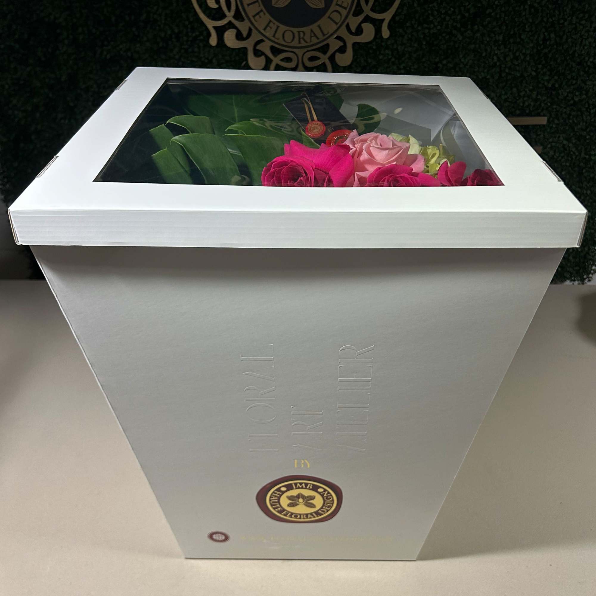 Handtied Bouquet with to pink, light pink or red roses and foliage