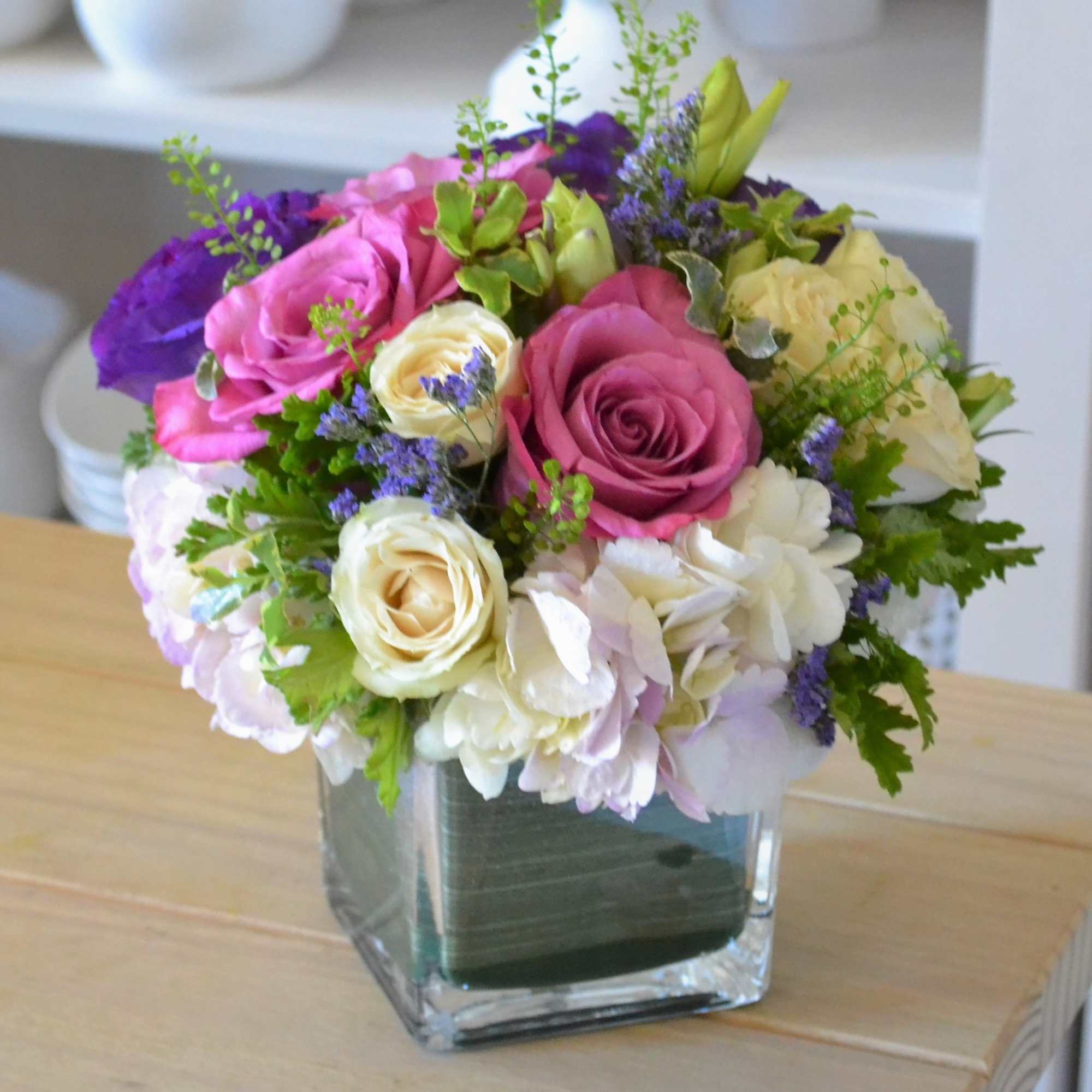 The Lavender grace arrangement is a mixture of white and green hydrangeas