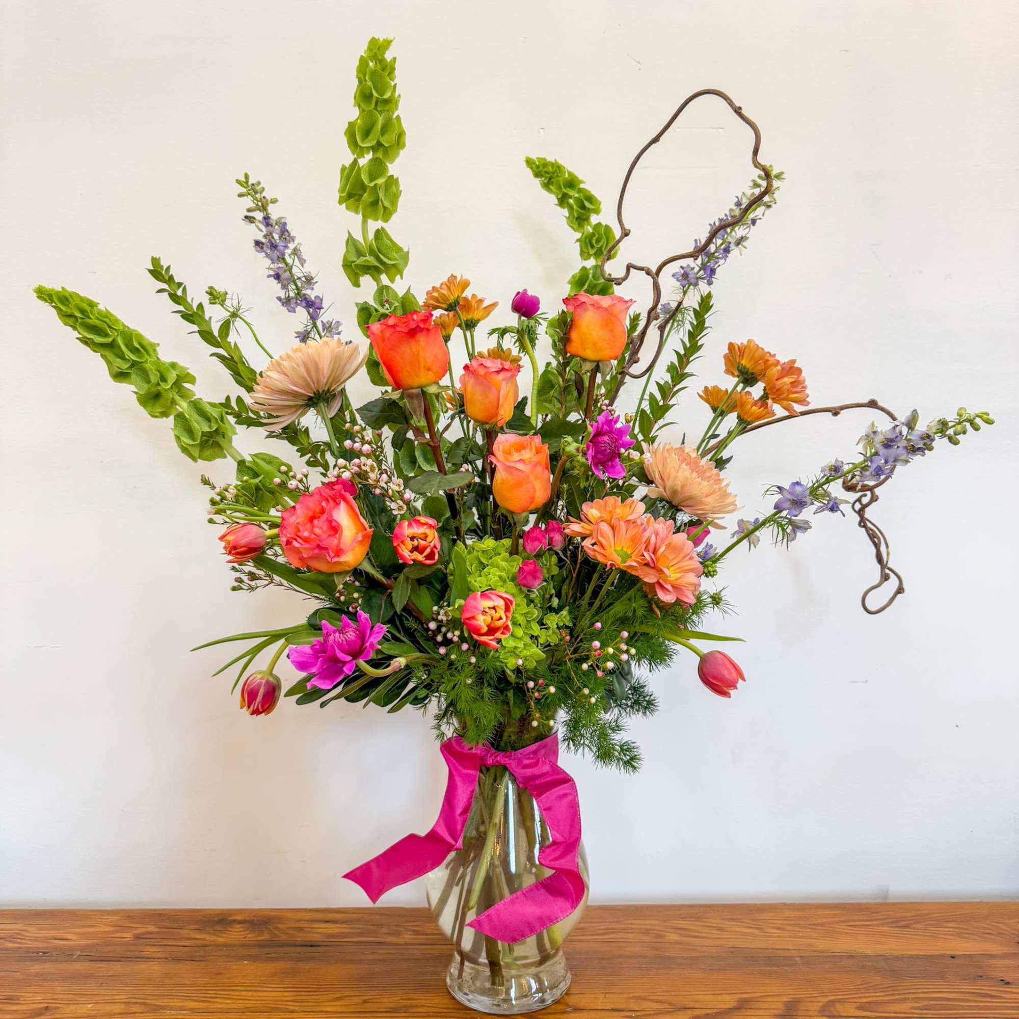 A bright palette of our freshest flowers in a large dramatic presentation.