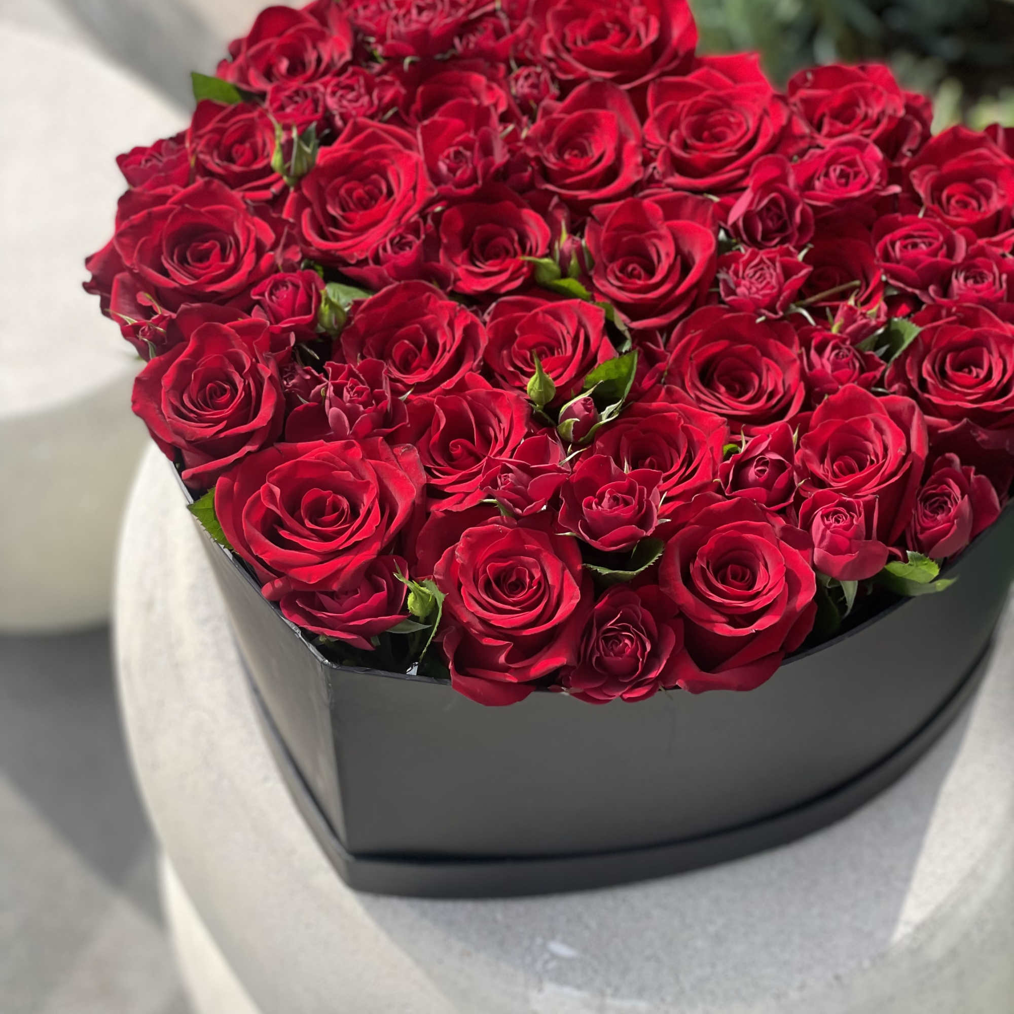 Gorgeous heart box with mix of red roses and garden red roses