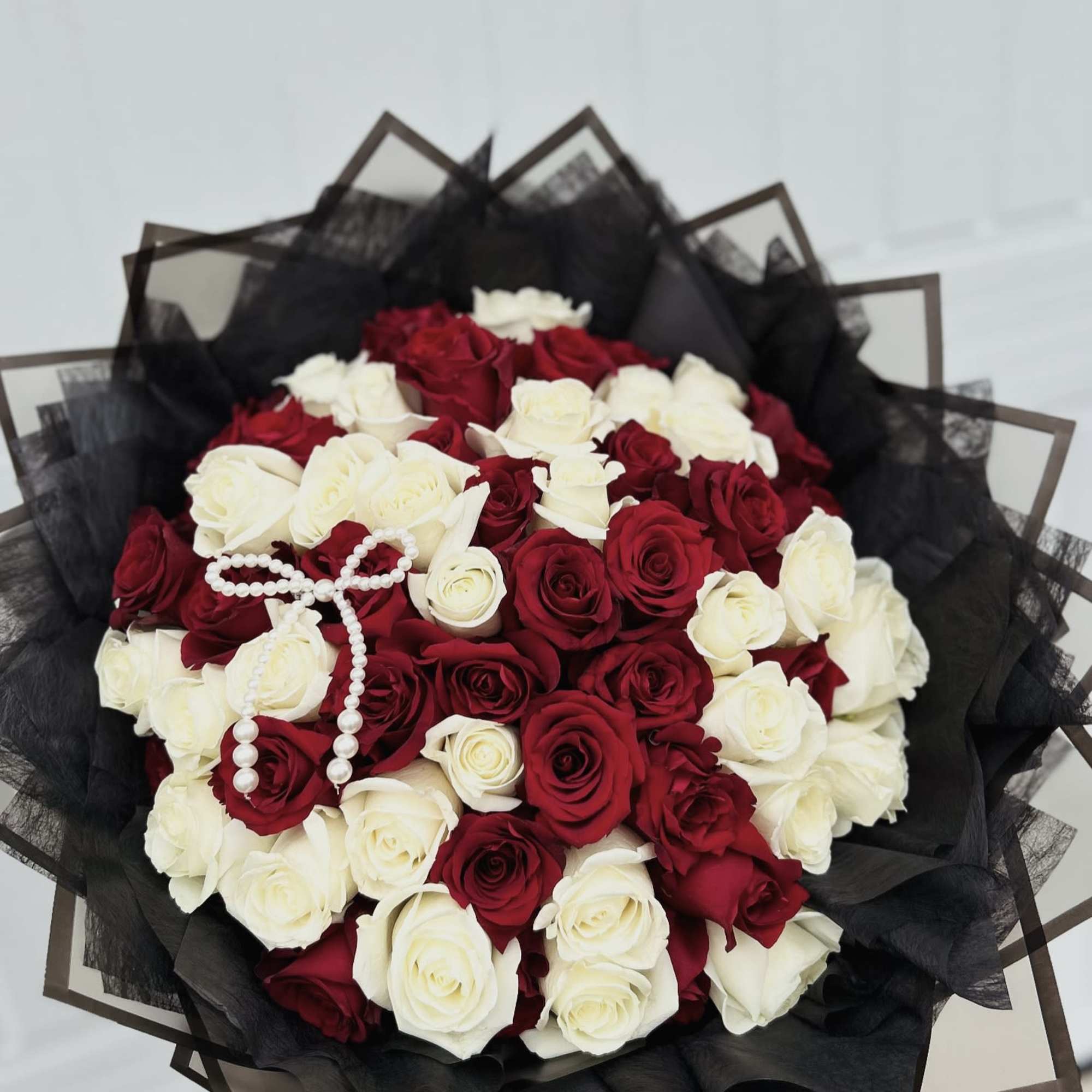 45 red and white roses with nice wrapping..
Note: Any wrapping colors available.