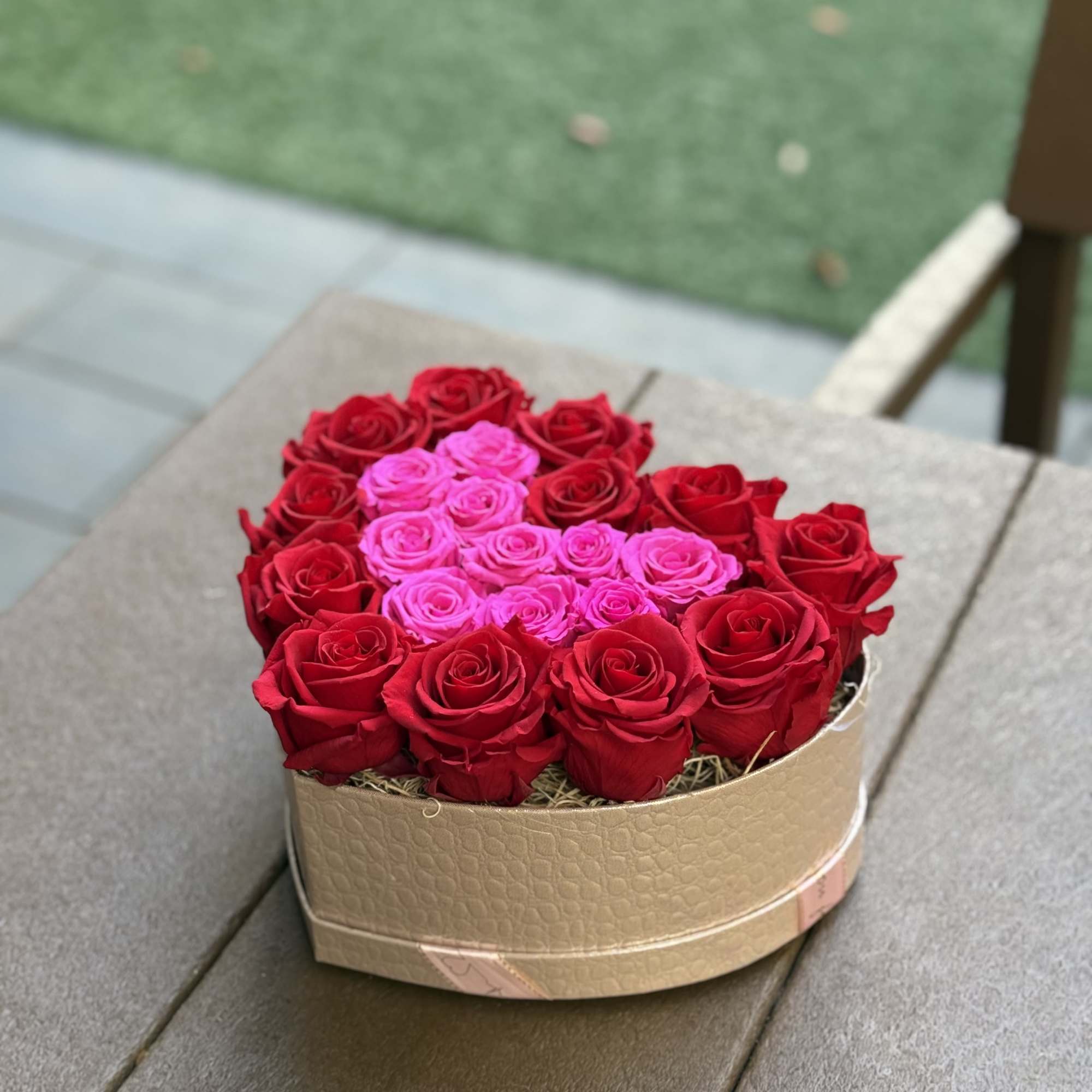 This heart-shaped preserved rose box features a bold ombr&eacute; effect with deep