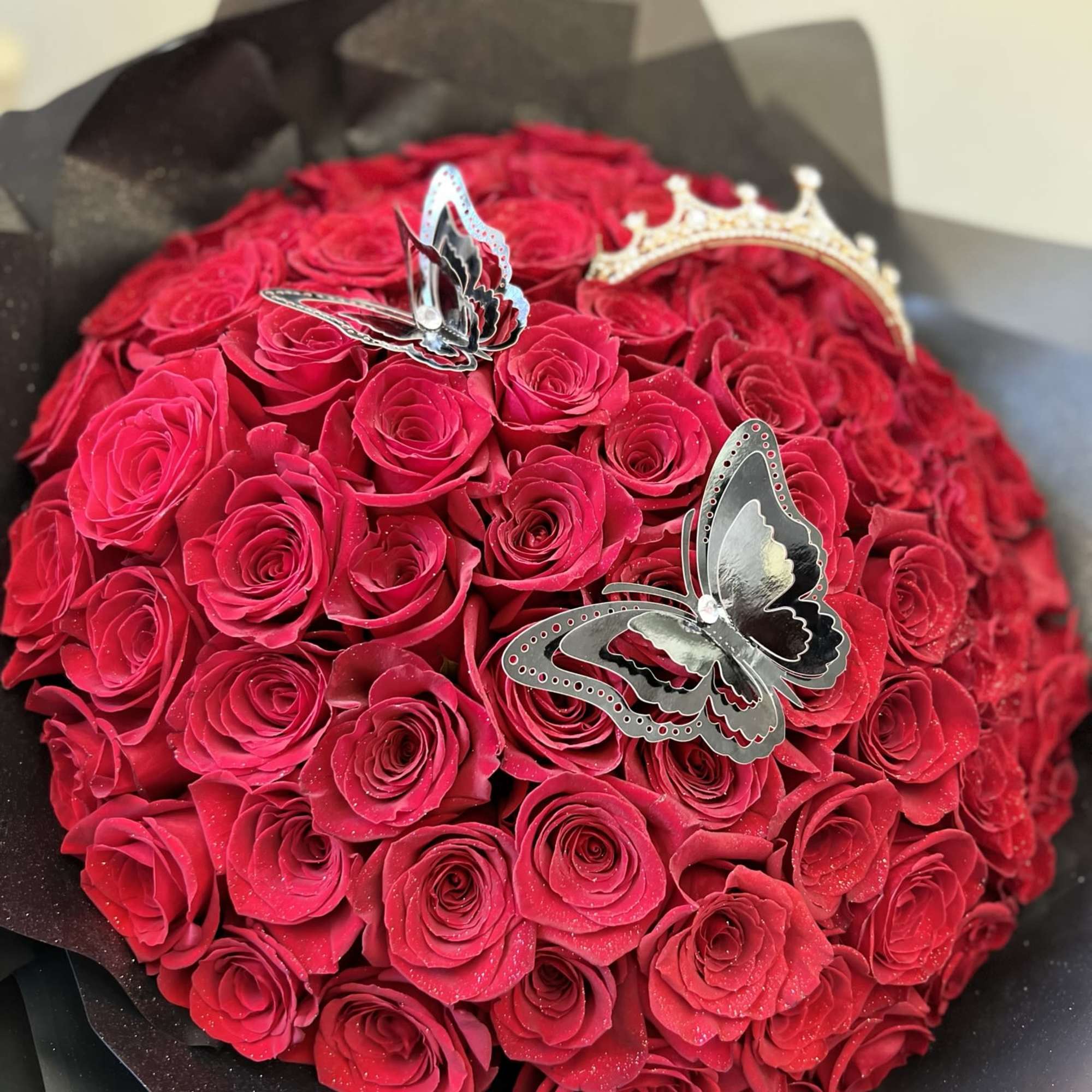 Bouquet of 75 Red Roses, with butterflies and a crown included.