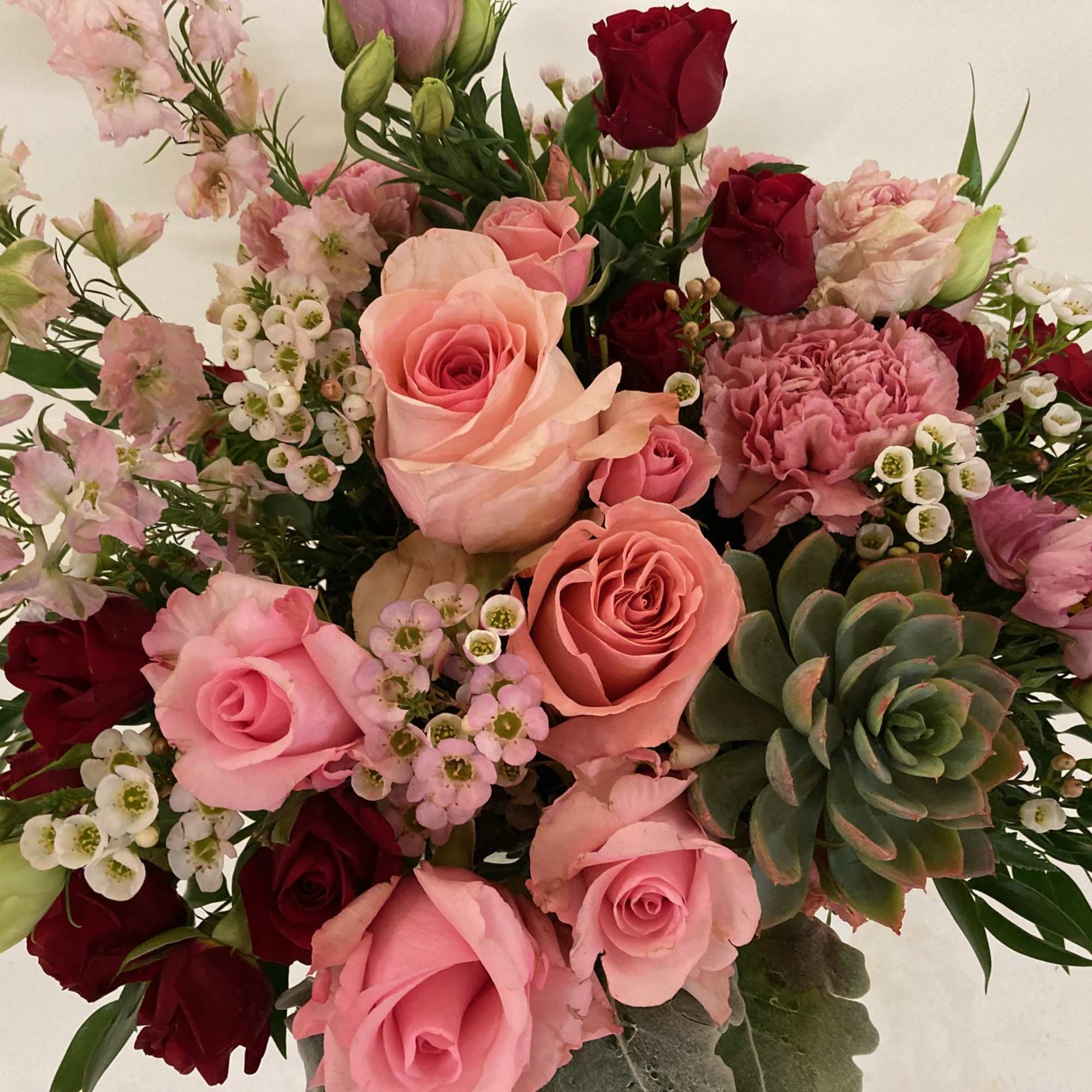 Pink and red roses with succulent